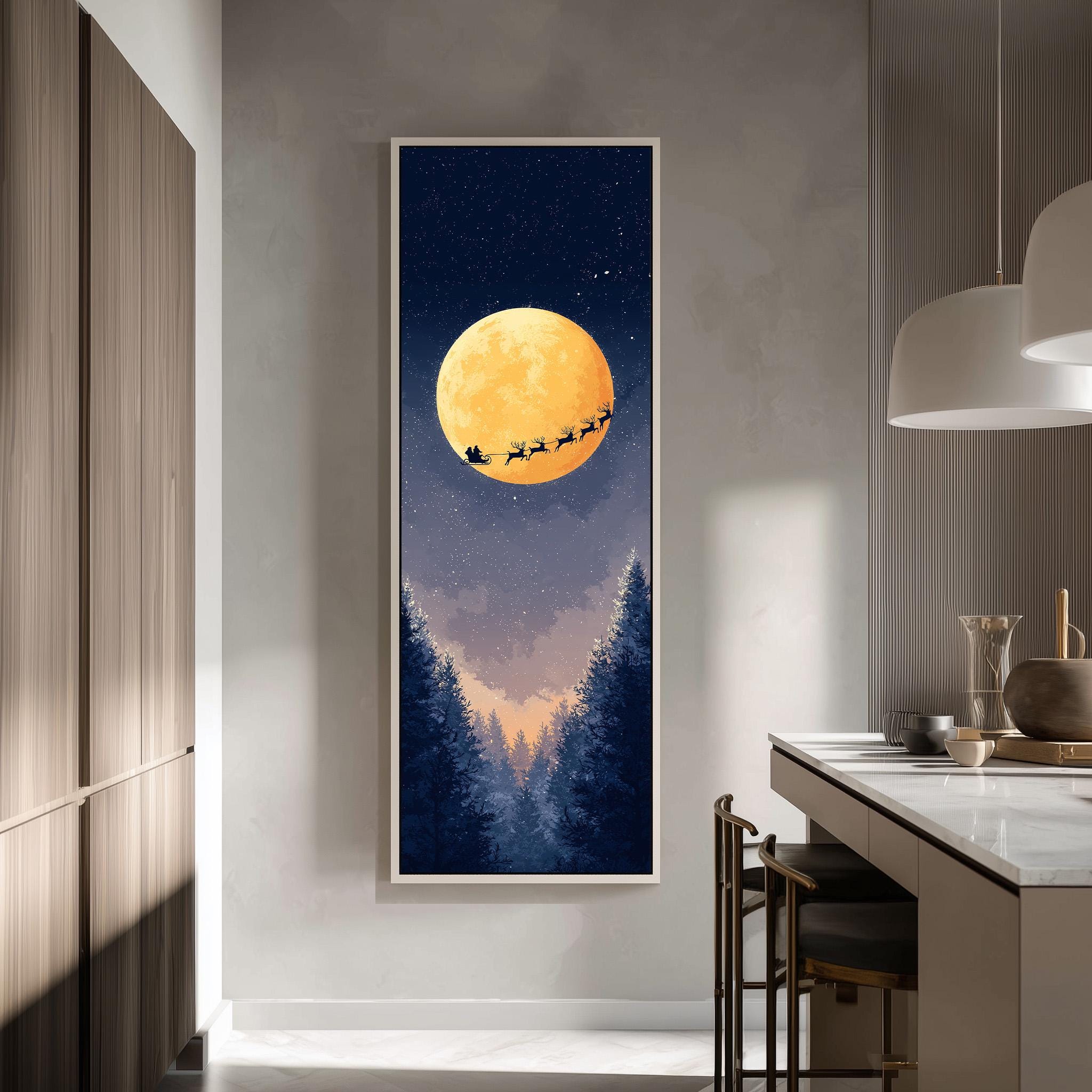 a large framed picture hanging on a wall, depicting a night scene with a full moon, a sleigh in the sky, and a snowy landscape below.