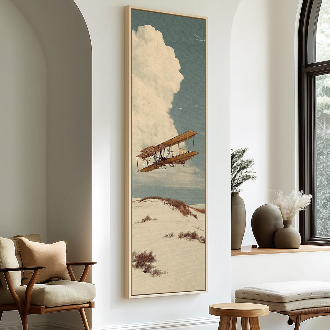 Vintage biplane over desert dunes long vertical canvas print in a sunlit living space