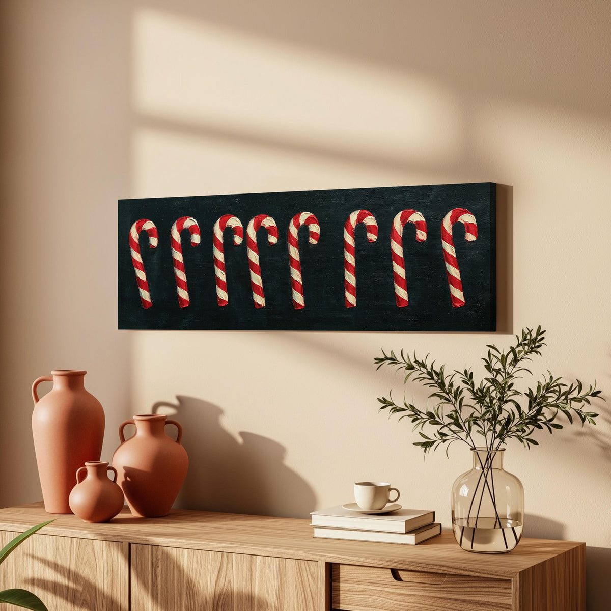 Row of candy canes on black long horizontal canvas print above a wooden sideboard