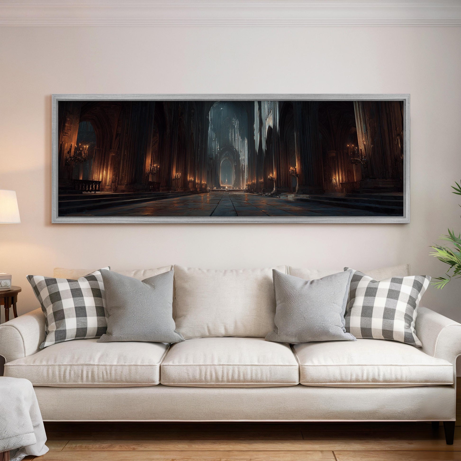 a large, framed painting of a cathedral scene hanging on a wall above a white sofa with patterned throw pillows.