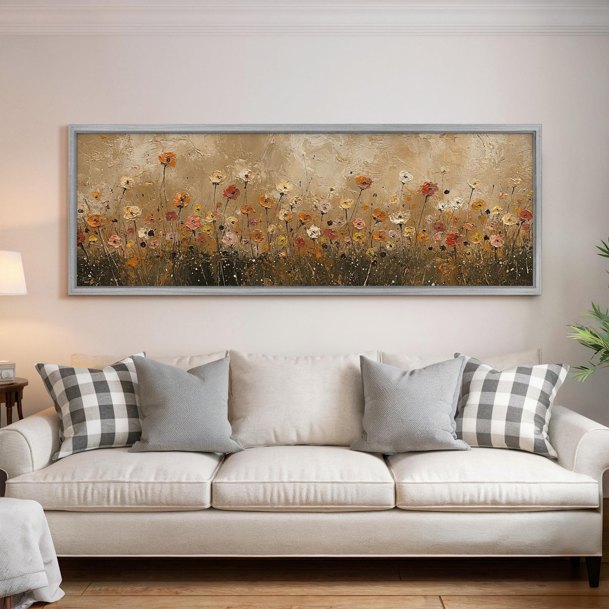 Golden wildflower field panoramic canvas print above a white sofa in a bright living room