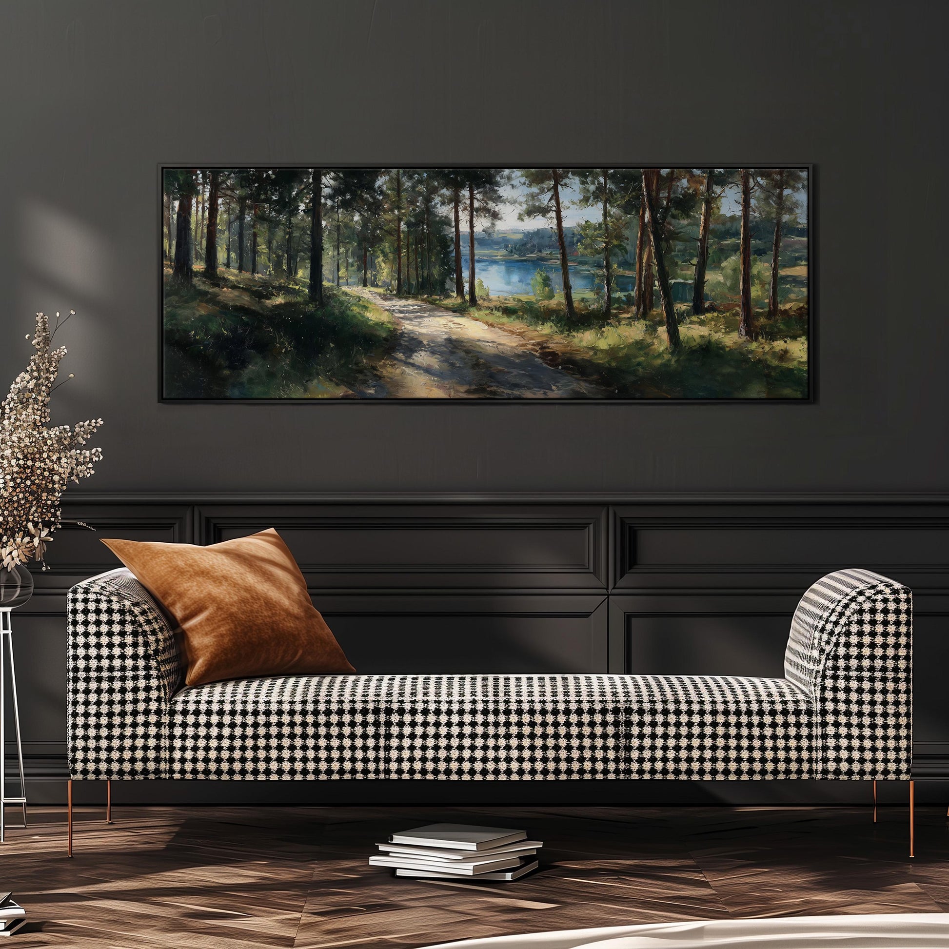 a large painting of a forest scene hanging on a wall above a black and white checkered sofa with a brown throw pillow.