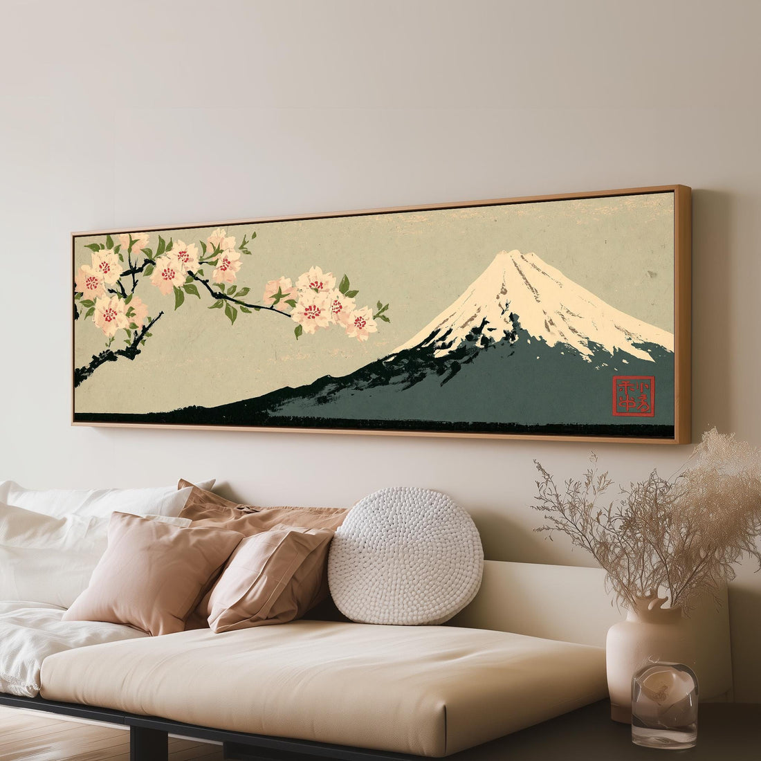 Cherry blossom branch and Mount Fuji long horizontal canvas print above a sofa in a living room