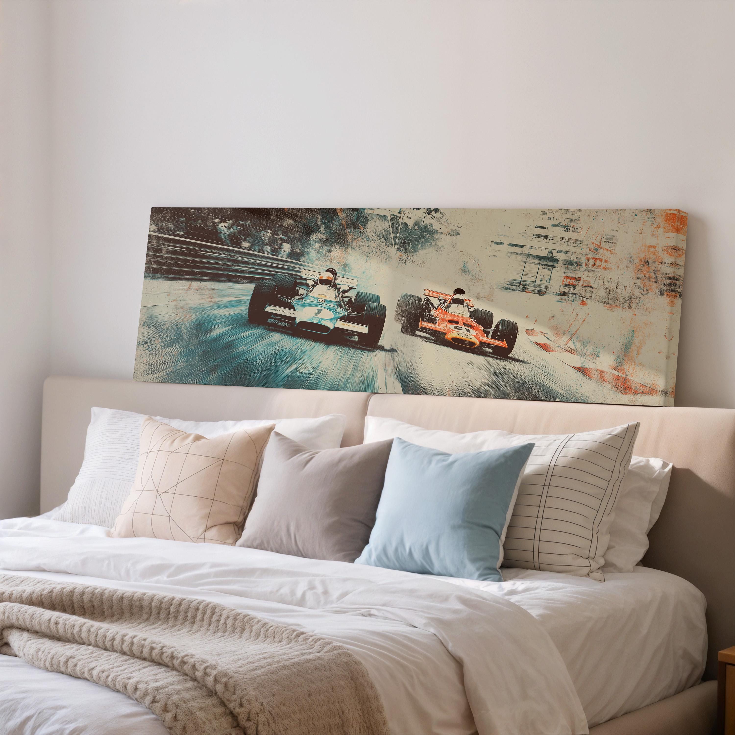 a large, colorful painting of two race cars speeding down a track, mounted on a wall above a bed with white bedding and pillows.