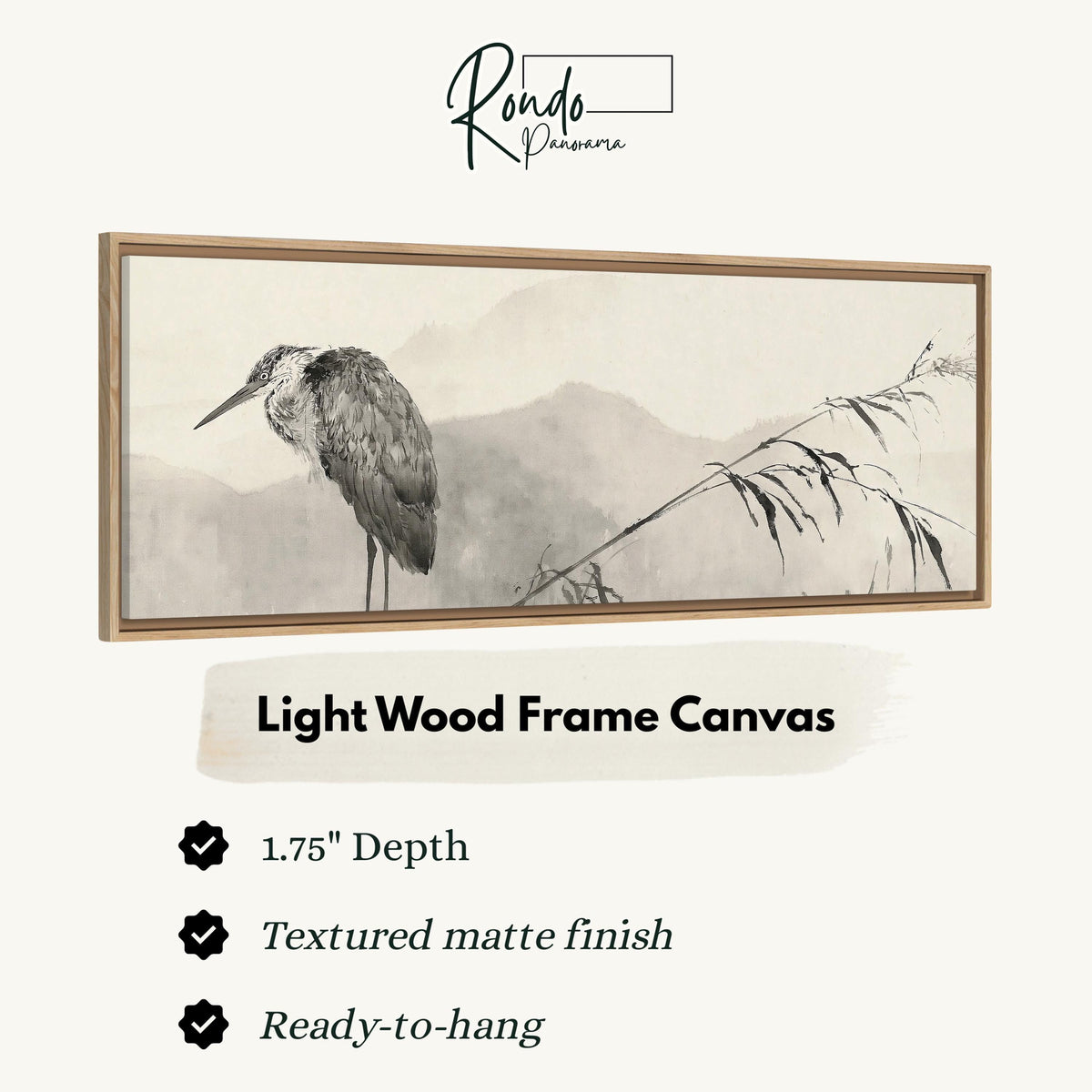 Heron in front of misty ink mountains canvas print in a light wood floating frame
