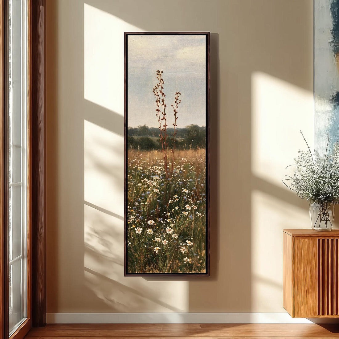 Tall seed pod stalk above a daisy meadow long vertical canvas print in a sunlit living space