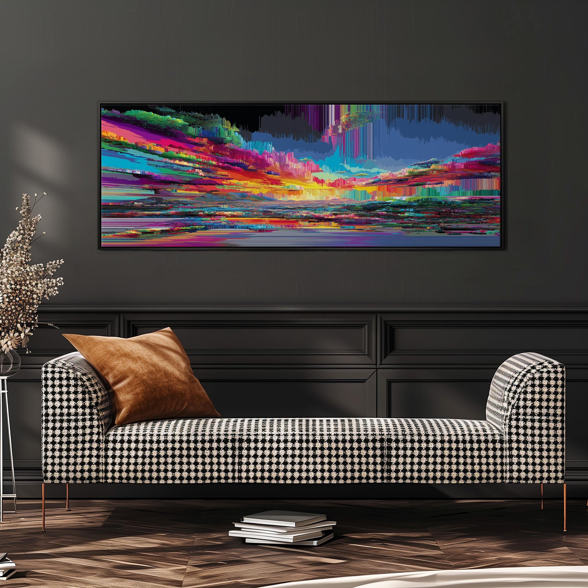 a checkered sofa with a stack of books on the floor in front of it, and a large abstract painting hanging on the wall above.