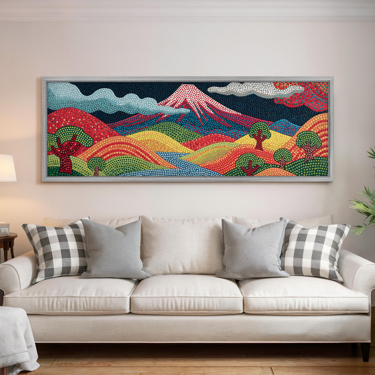 Mount Fuji above rainbow dotted hills panoramic canvas print above a white sofa in a bright living room