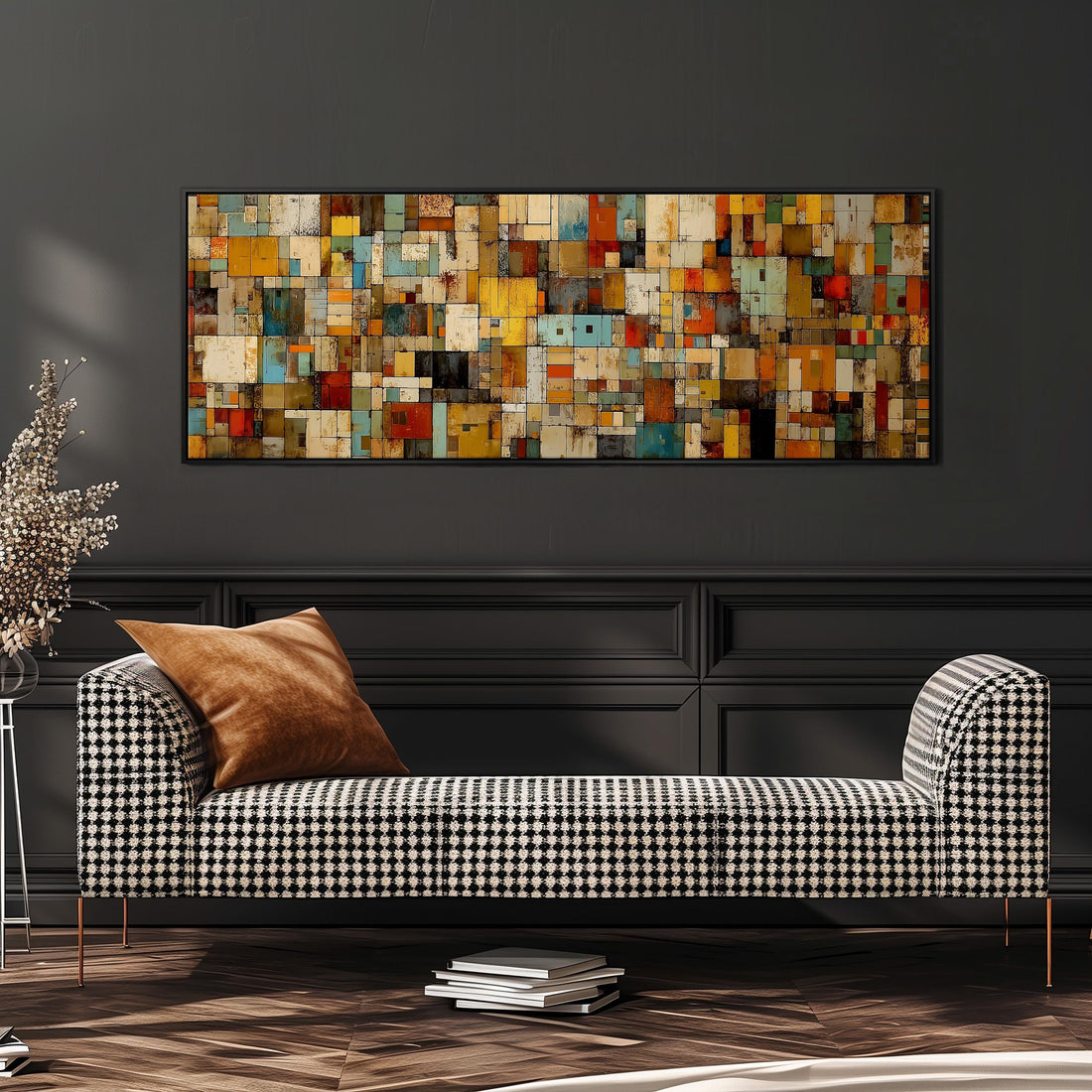 a large, colorful abstract painting hanging on a wall above a brown sofa with two pillows.