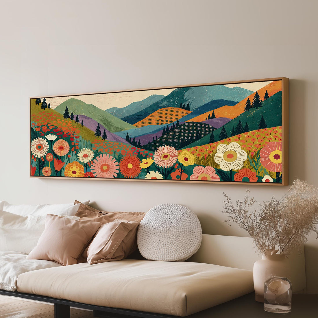 Wildflower valley below patterned mountains long horizontal canvas print above a sofa in a living room