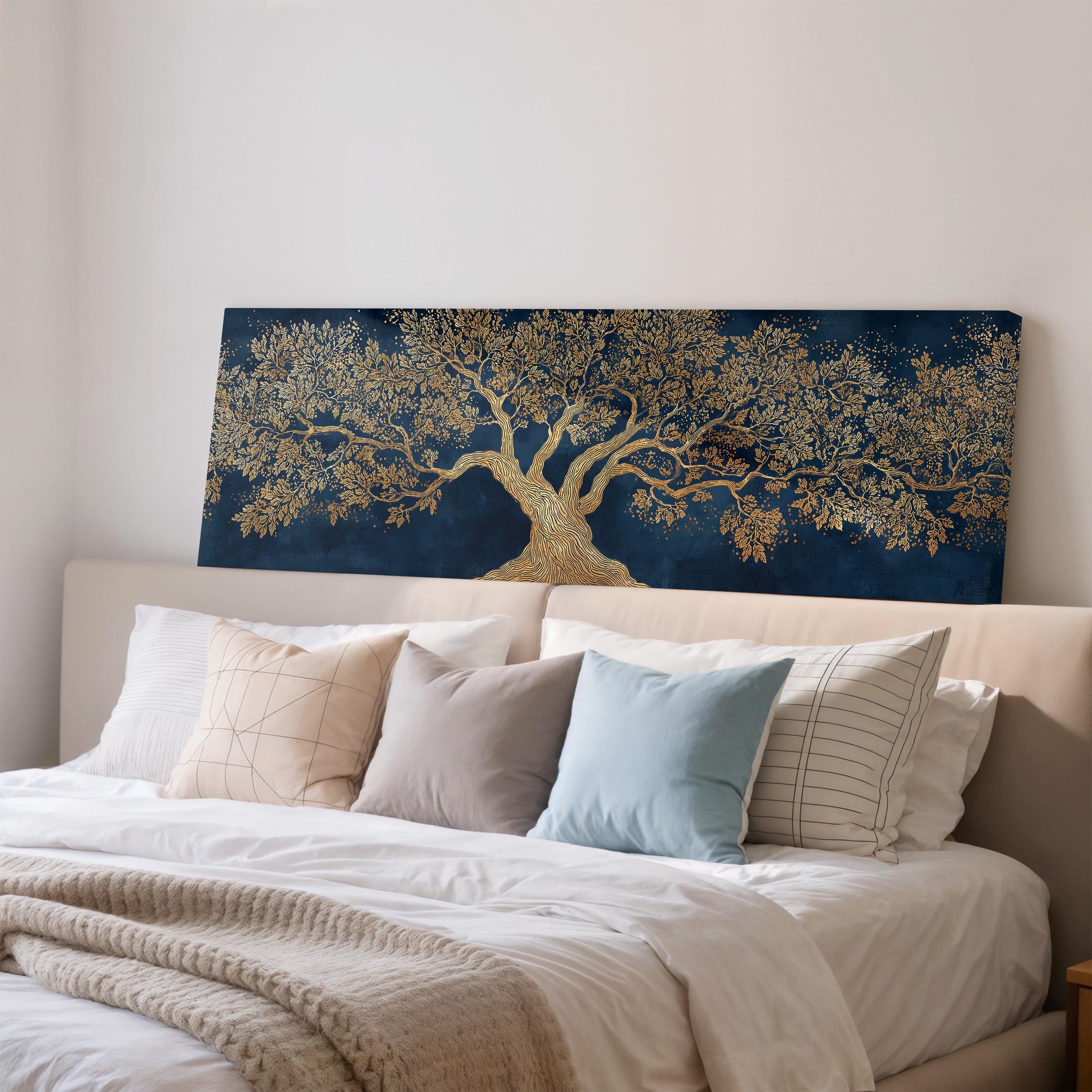a large bed with a blue and gold tree painting on the headboard, creating a striking contrast against the white wall.