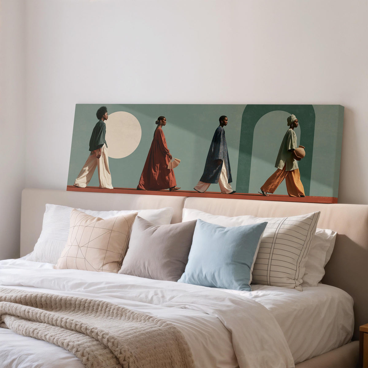 Women walking past arches and a pale moon wide panoramic canvas print above a bed in a bedroom