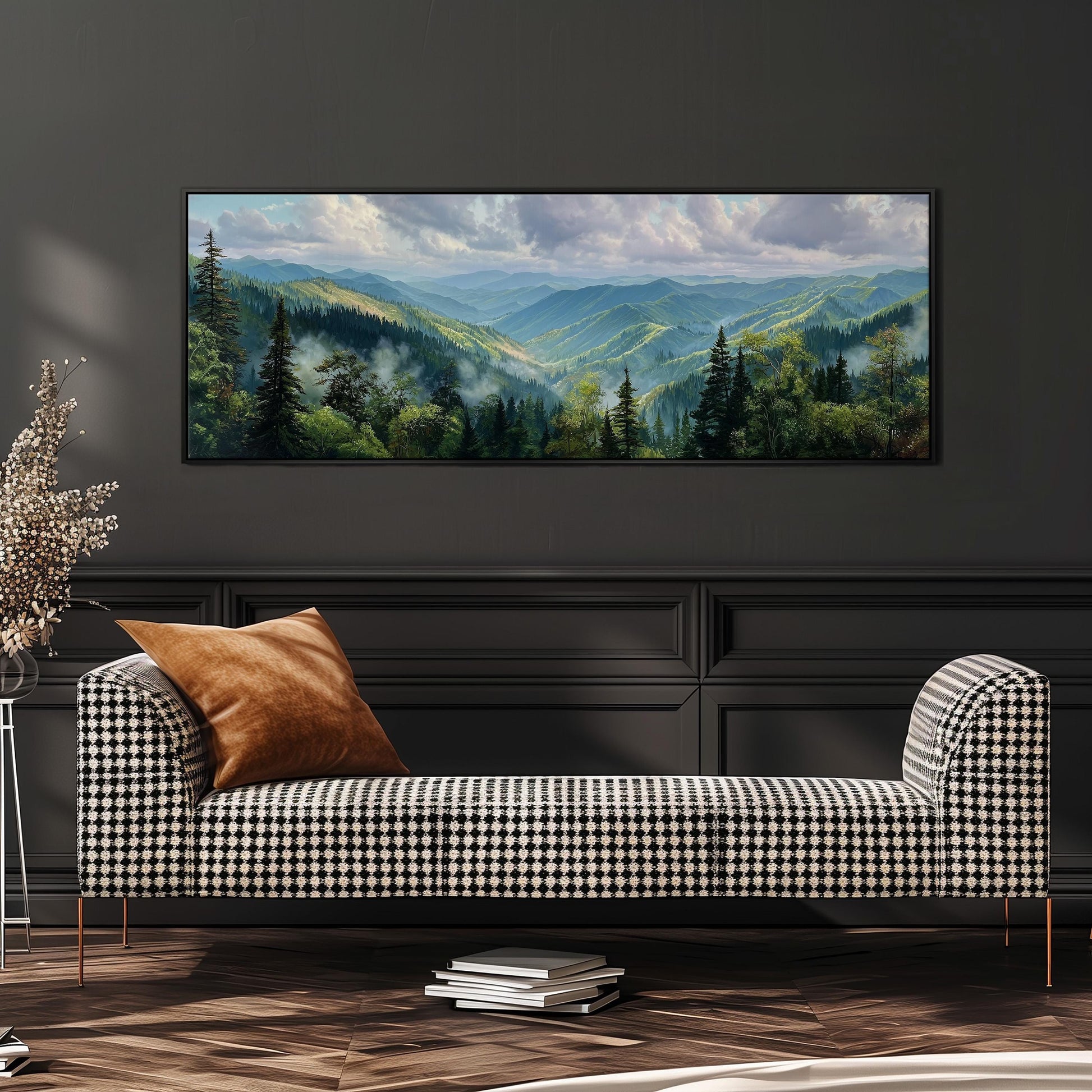 a large landscape painting hanging on a wall above a black and white checkered sofa in a living room setting.