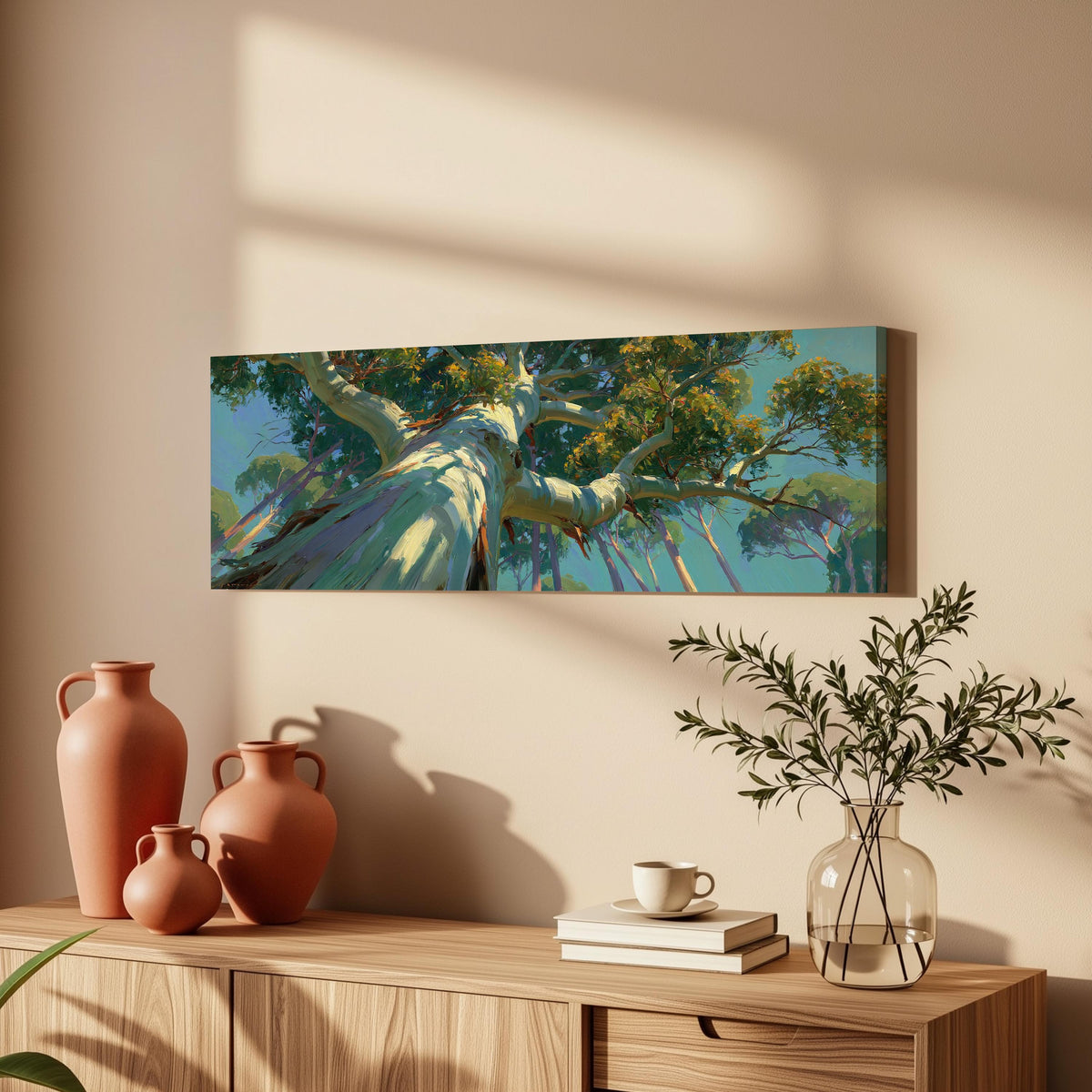 Eucalyptus canopy against a blue sky long horizontal canvas print above a wooden sideboard