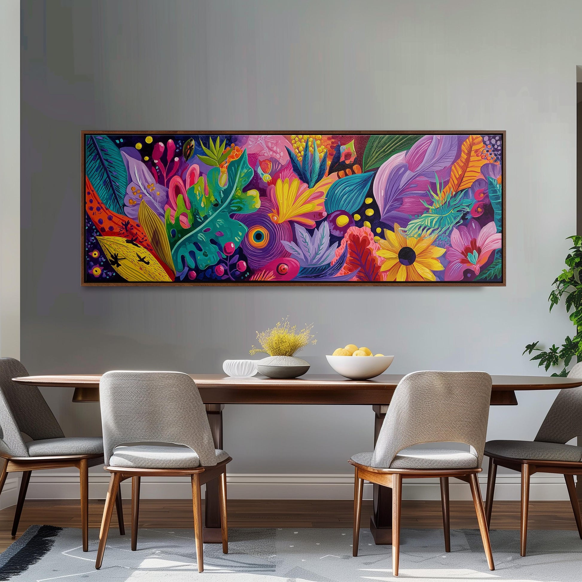 a large, colorful painting of a tropical garden hanging on a wall above a wooden dining table with four chairs.
