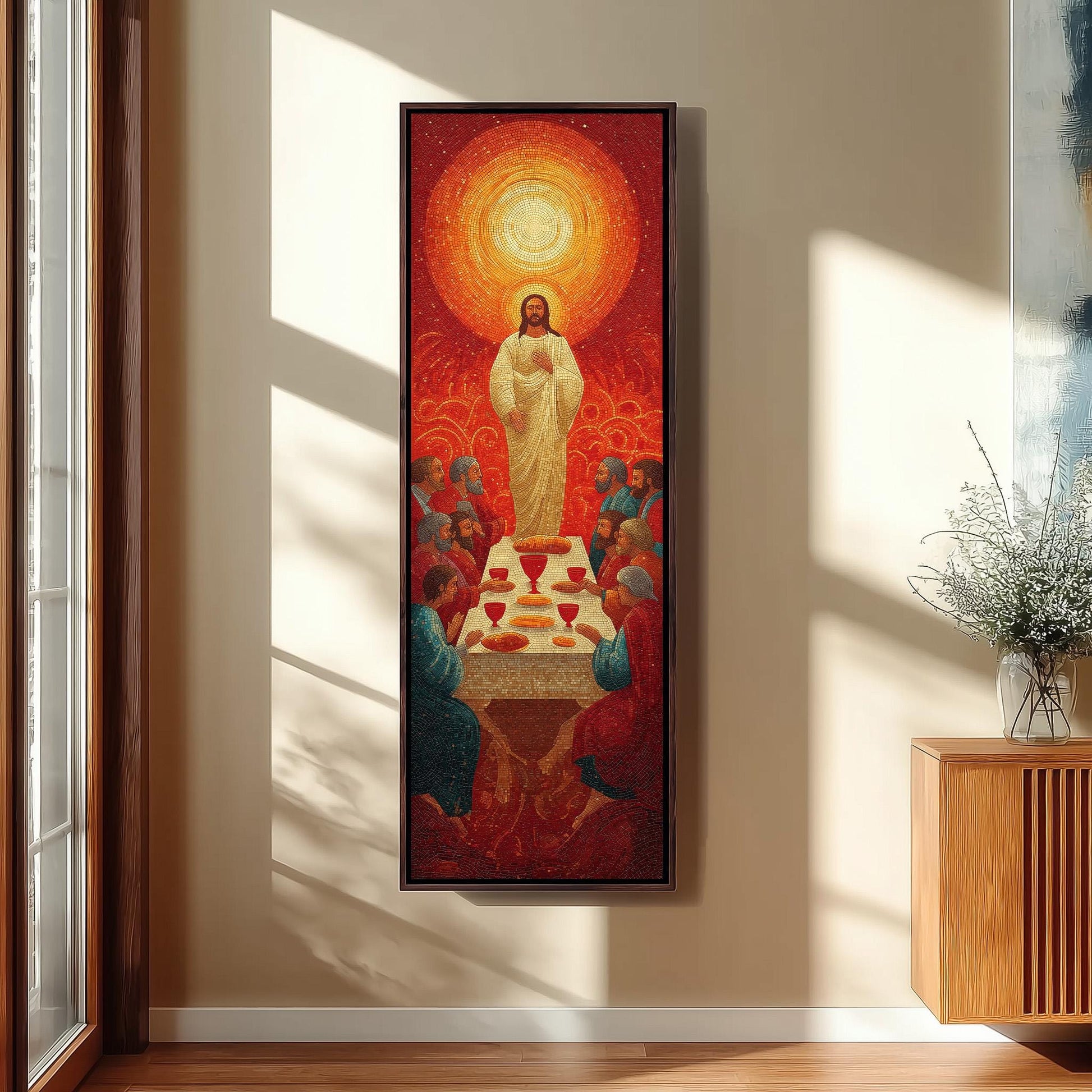 a large painting of Jesus Christ surrounded by a group of people, with a table in the center of the scene. The painting is hanging on a wall, and there is a vase of flowers to the right of the painting.
