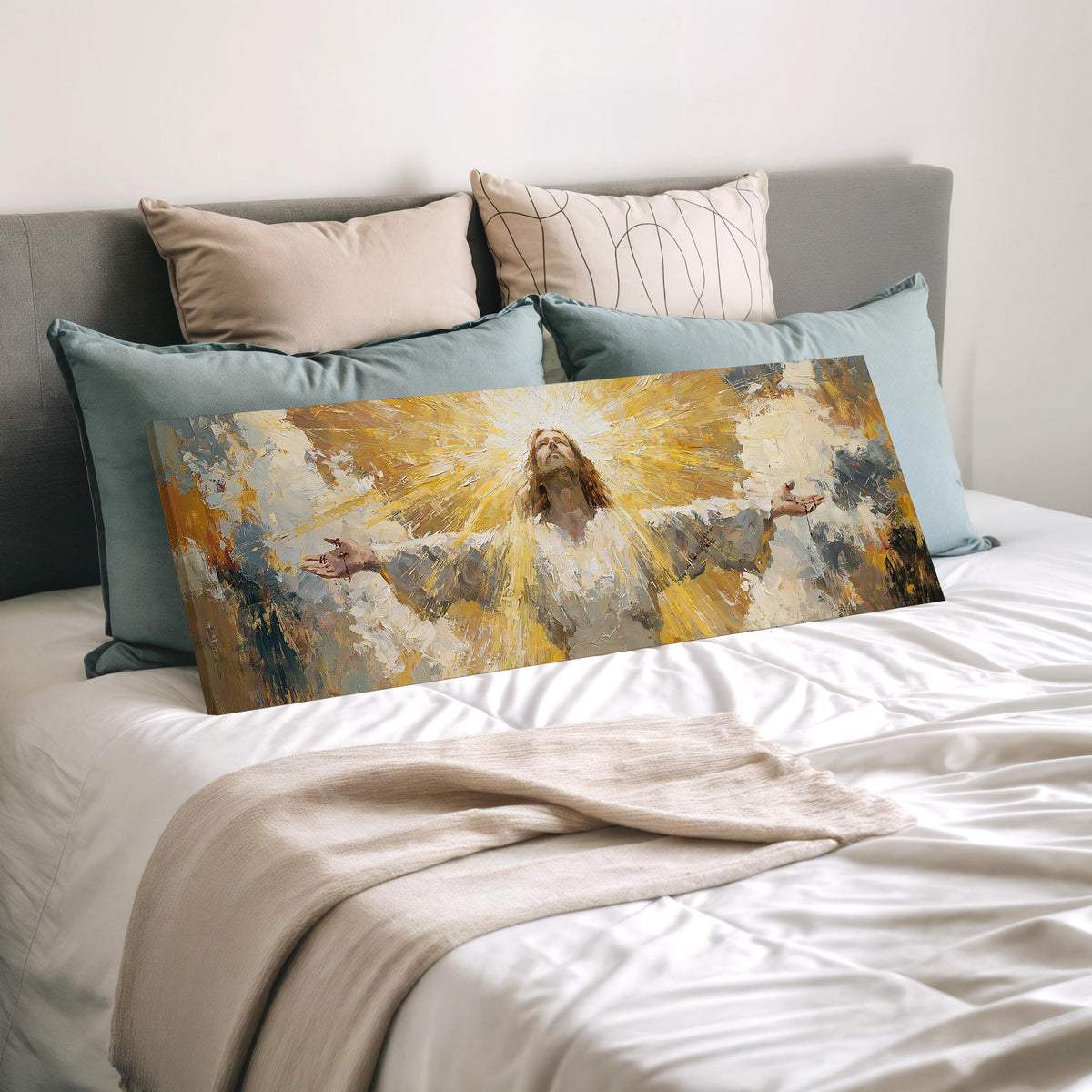 Risen Christ in golden light wide panoramic canvas print laid on a bed to show its size
