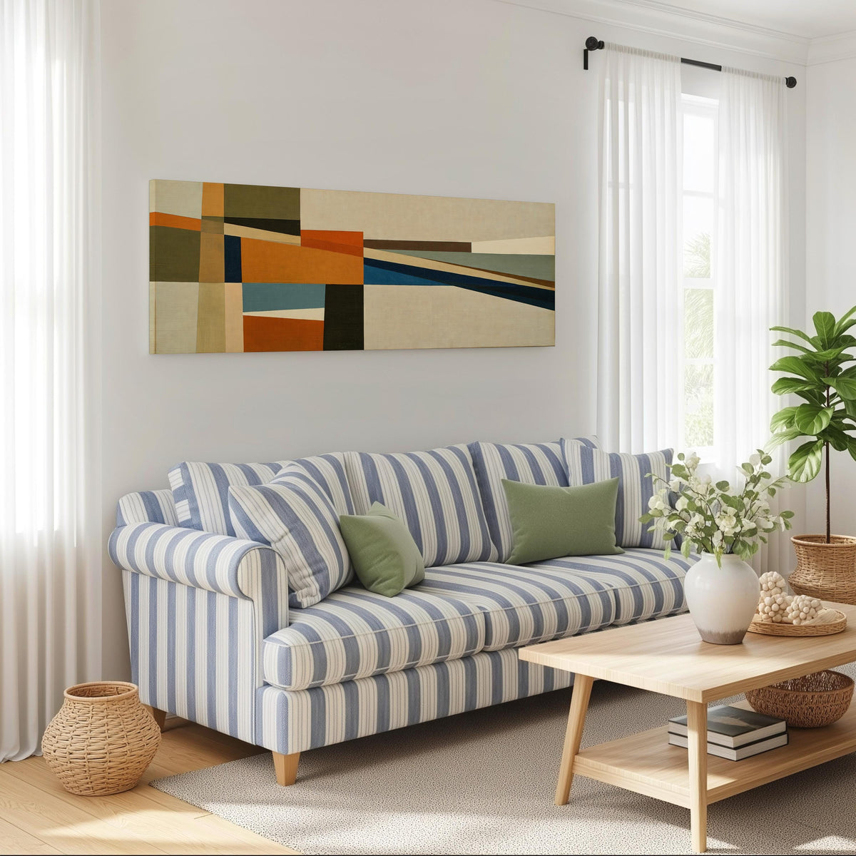 Olive and rust geometric blocks long horizontal canvas print above a striped sofa in a coastal living room