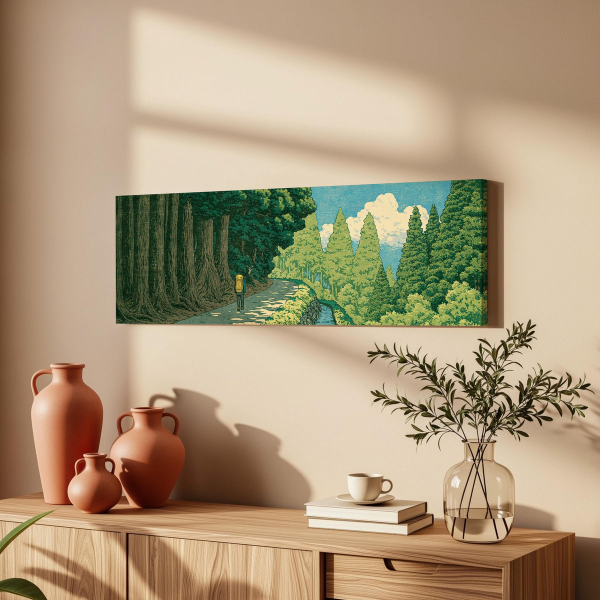 Hiker on a forest trail long horizontal canvas print above a wooden sideboard