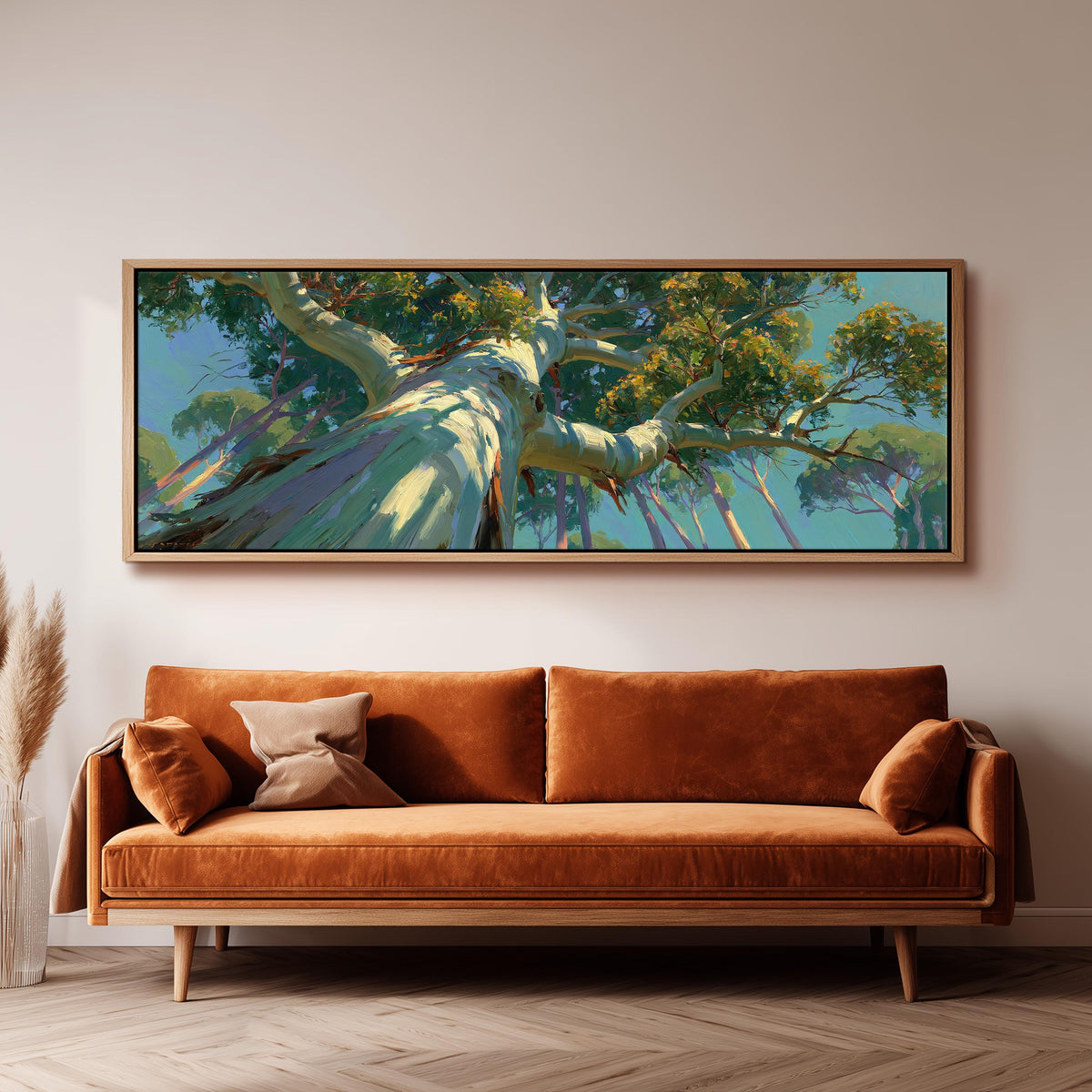 Eucalyptus canopy against a blue sky long horizontal canvas print above a sofa in a living room