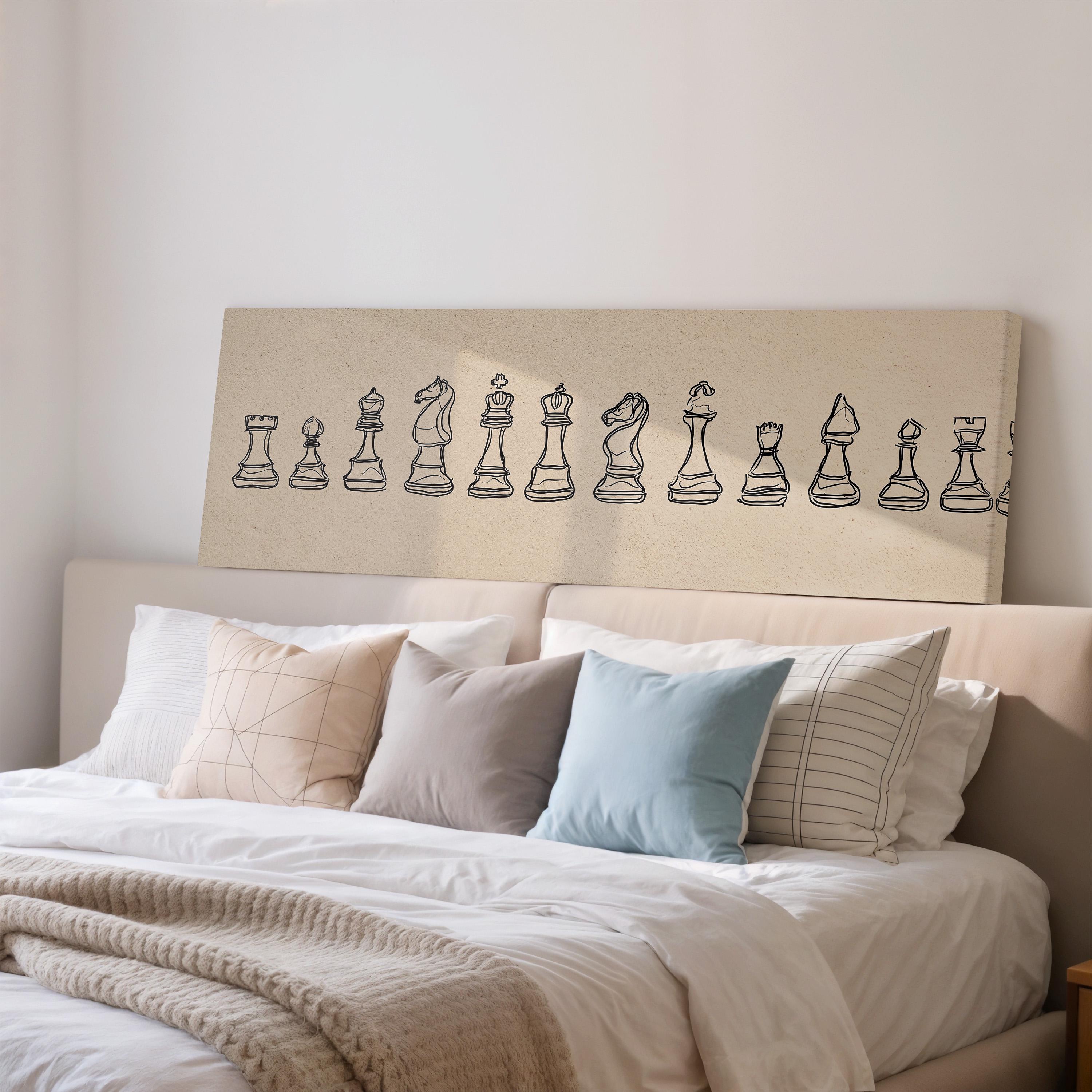 a bedroom with a bed and a wall art piece depicting a chessboard with various chess pieces.