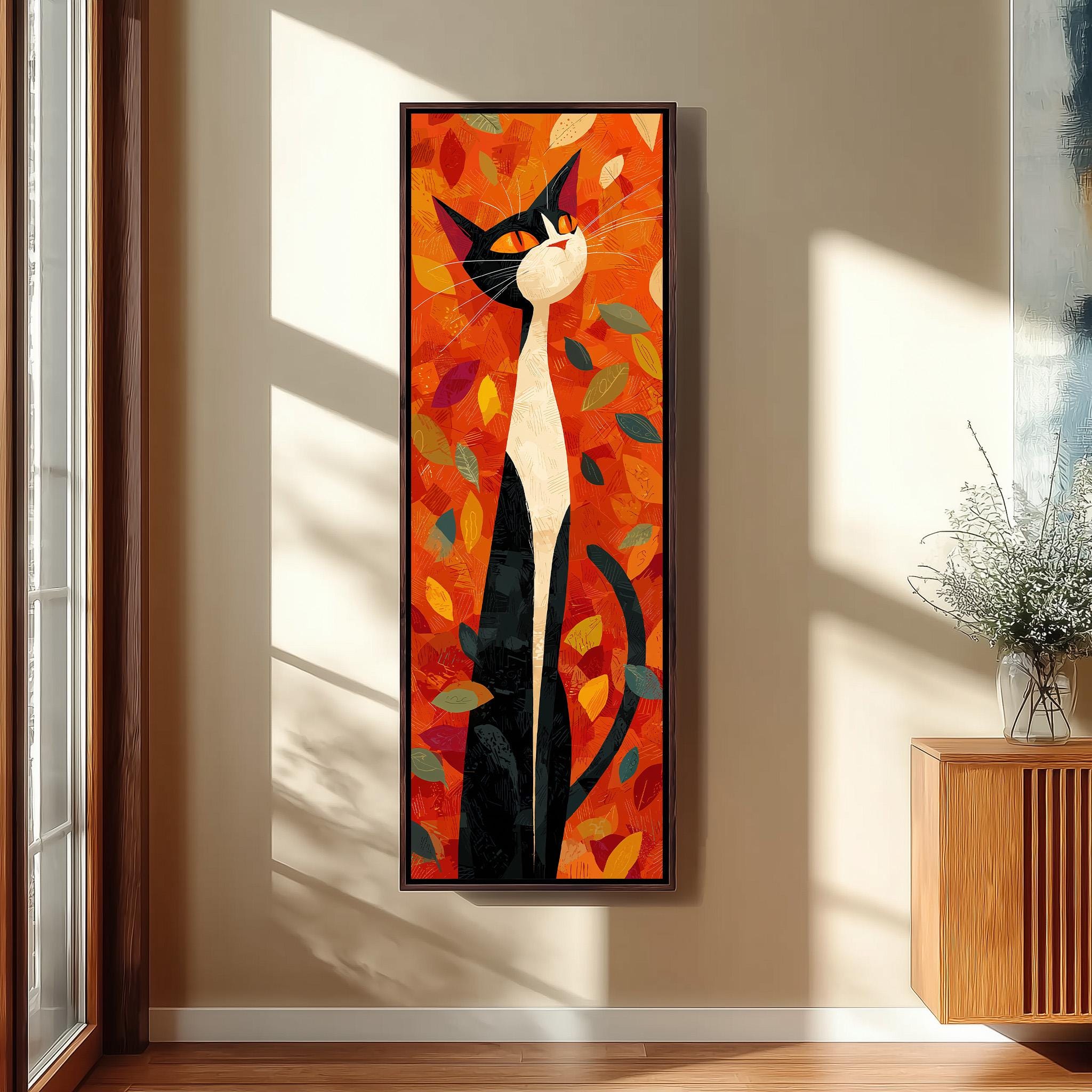 a large, colorful painting of a cat with a predominantly orange and black color scheme, surrounded by leaves and branches. The painting is hanging on a wall in a room with a wooden cabinet and a vase of flowers nearby.