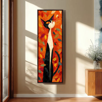 a large, colorful painting of a cat with a predominantly orange and black color scheme, surrounded by leaves and branches. The painting is hanging on a wall in a room with a wooden cabinet and a vase of flowers nearby.