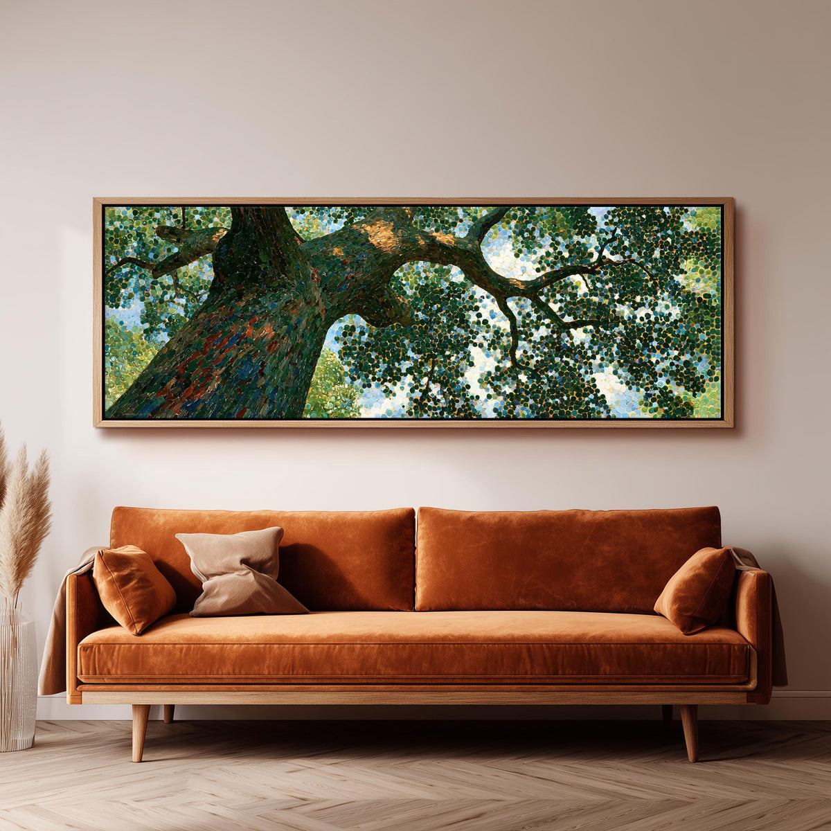 Looking up into an oak canopy panoramic canvas print above a sofa in a living room