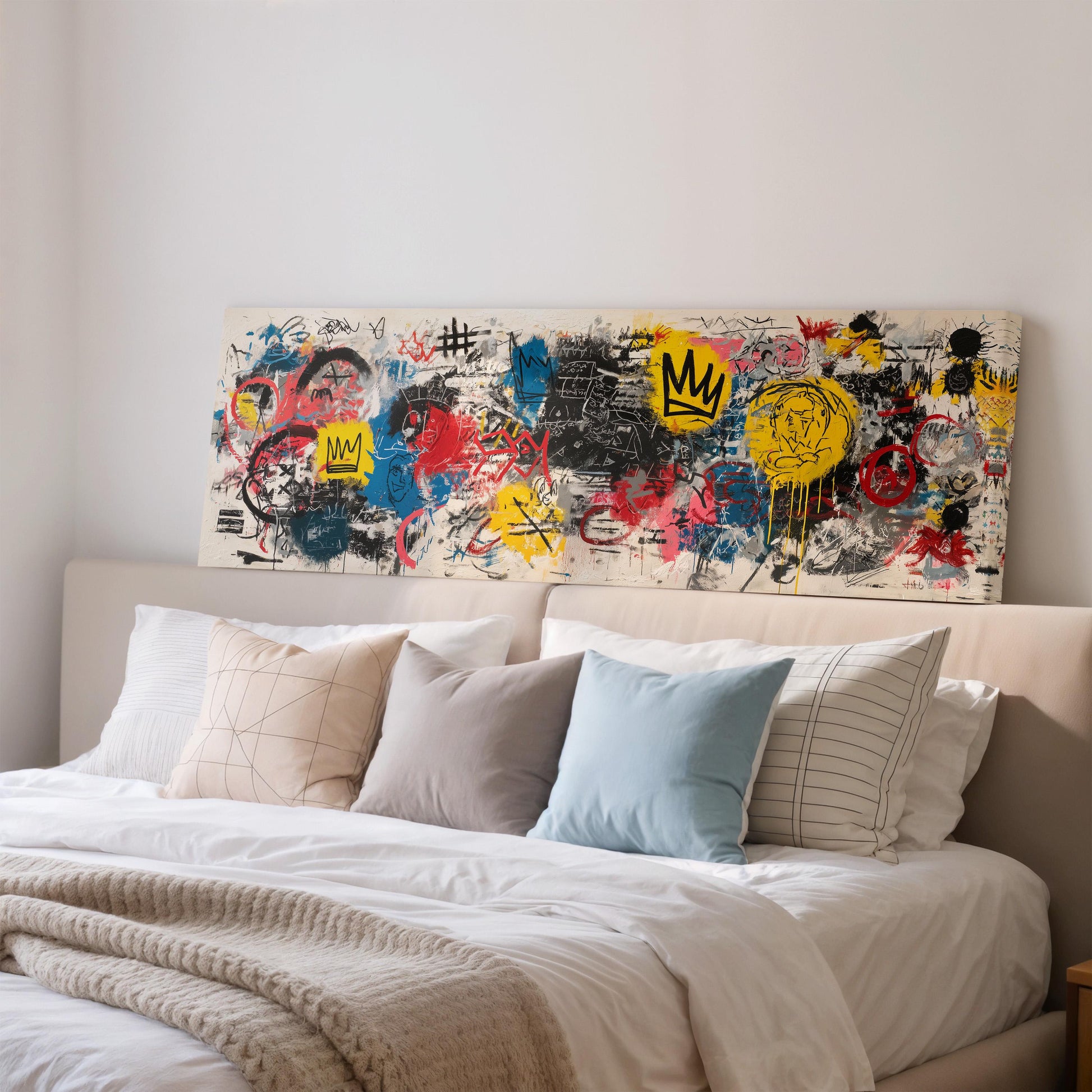 a large, colorful painting or artwork displayed on the wall above a bed with white bedding and pillows.