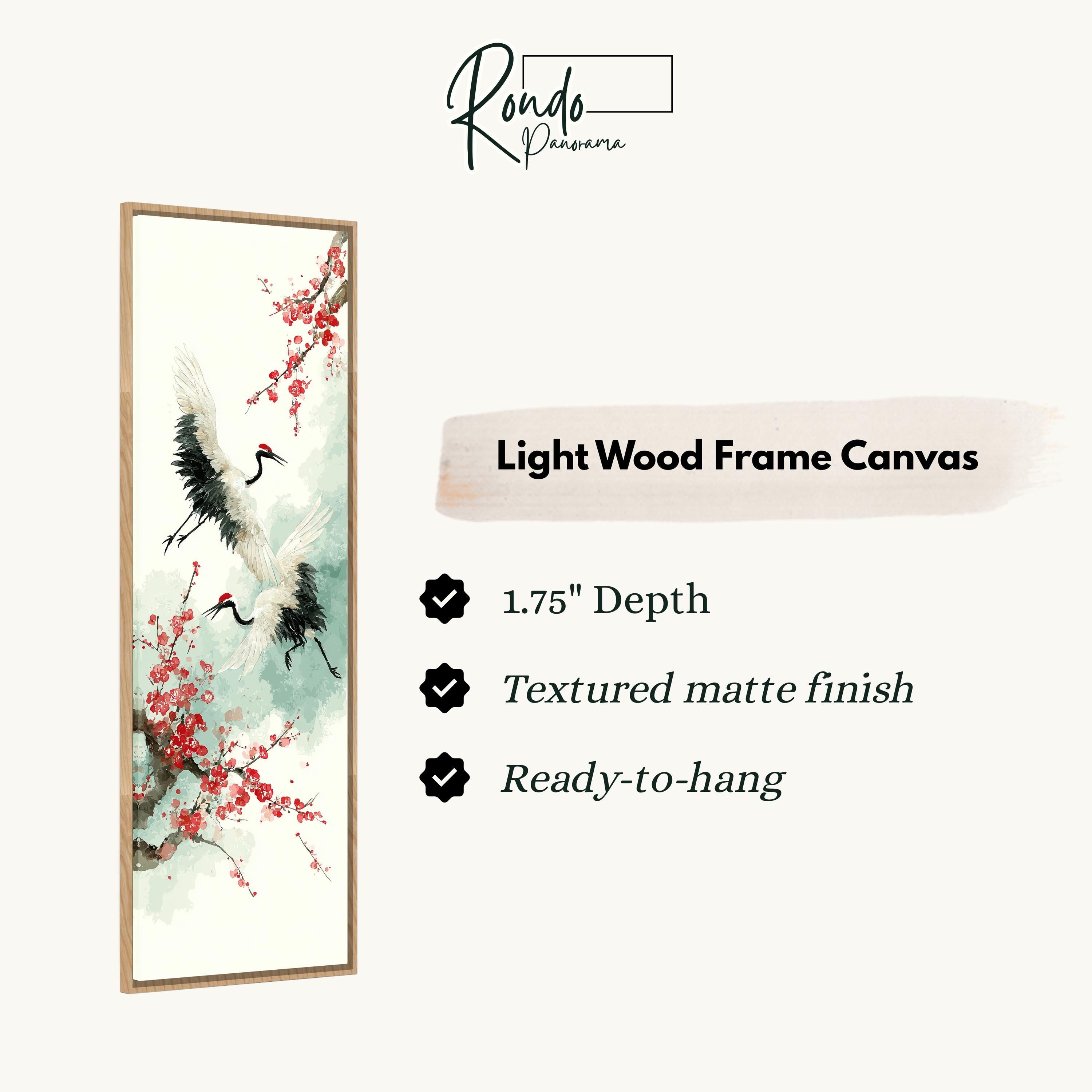 The image is a light wood frame canvas featuring a painting of two cranes in flight with red flowers. The canvas has a 1.75" depth, is textured with a matte finish, and is ready to hang.