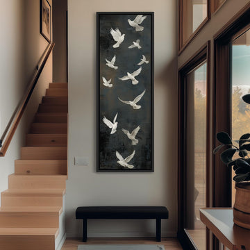 a hallway with a large painting of white birds in flight hanging on the wall. The painting is framed and appears to be a focal point in the space. The hallway has a wooden staircase leading up to the painting, and there is a bench in the foreground. The overall atmosphere of the image is calm and serene, with the white birds and the painting creating a sense of tranquility.