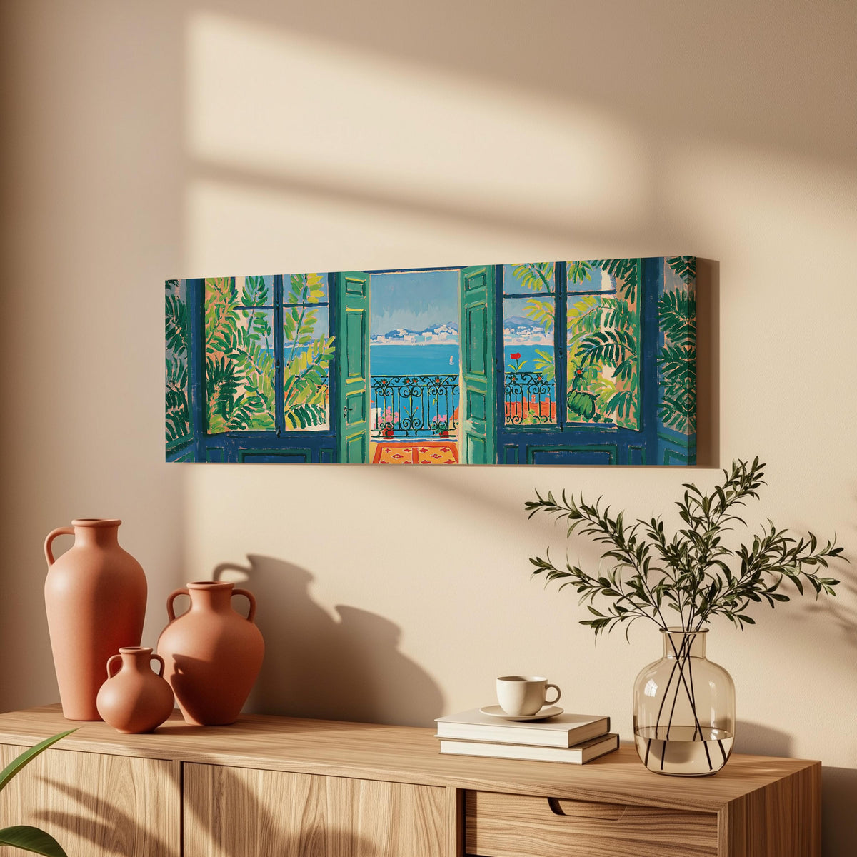 Riviera balcony view through open windows long horizontal canvas print above a wooden sideboard