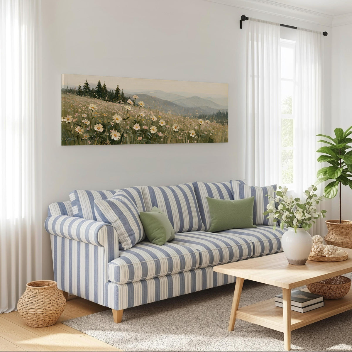 Daisy hillside below blue mountains long horizontal canvas print above a striped sofa in a coastal living room