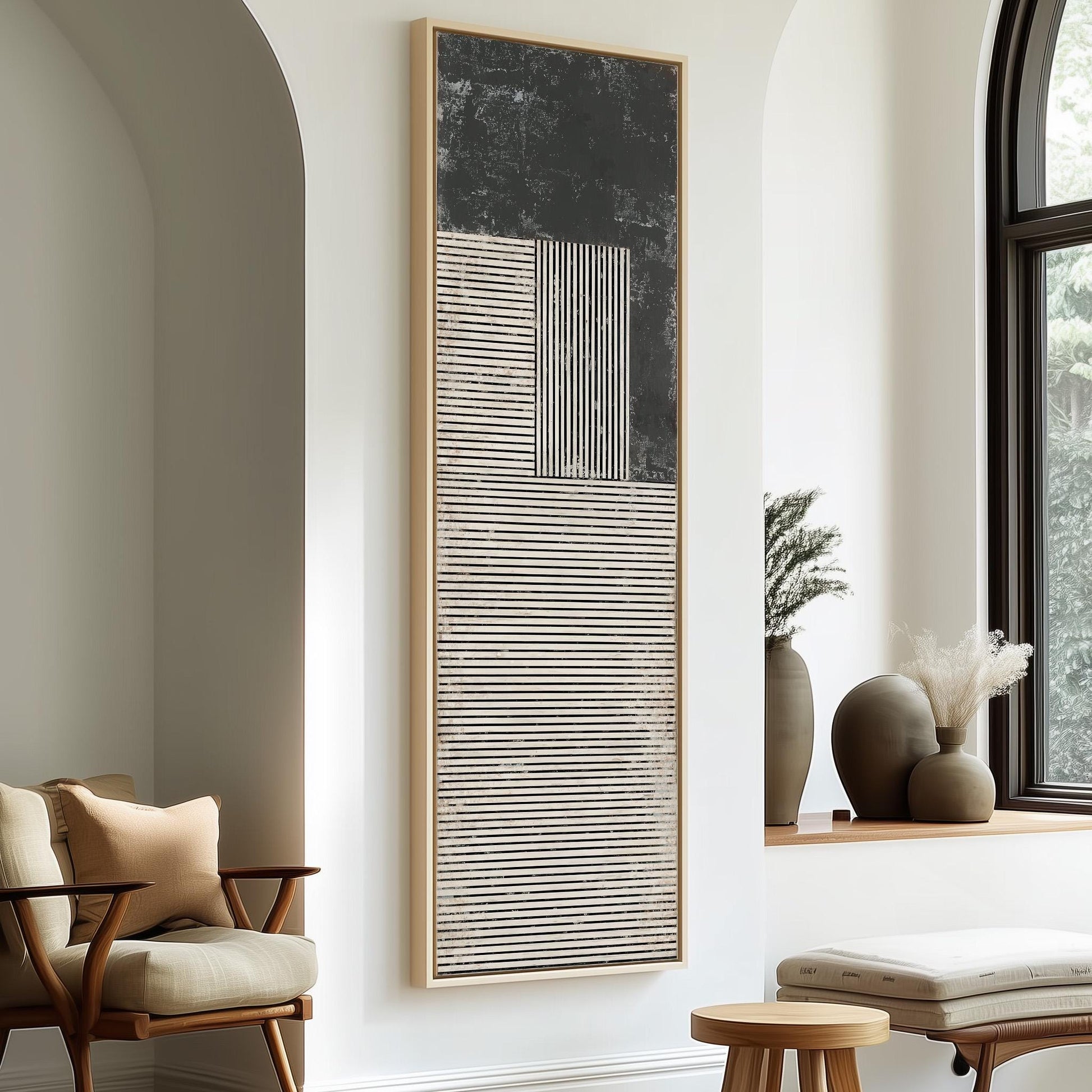 a modern and minimalist living room with a large abstract painting on the wall, a wooden chair, a small table, and a window with a plant on the sill.