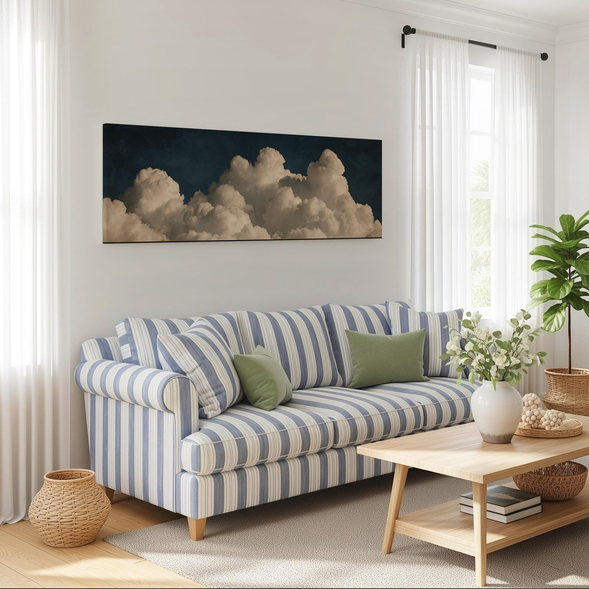 Cumulus clouds against a dark night sky long horizontal canvas print above a striped sofa in a coastal living room