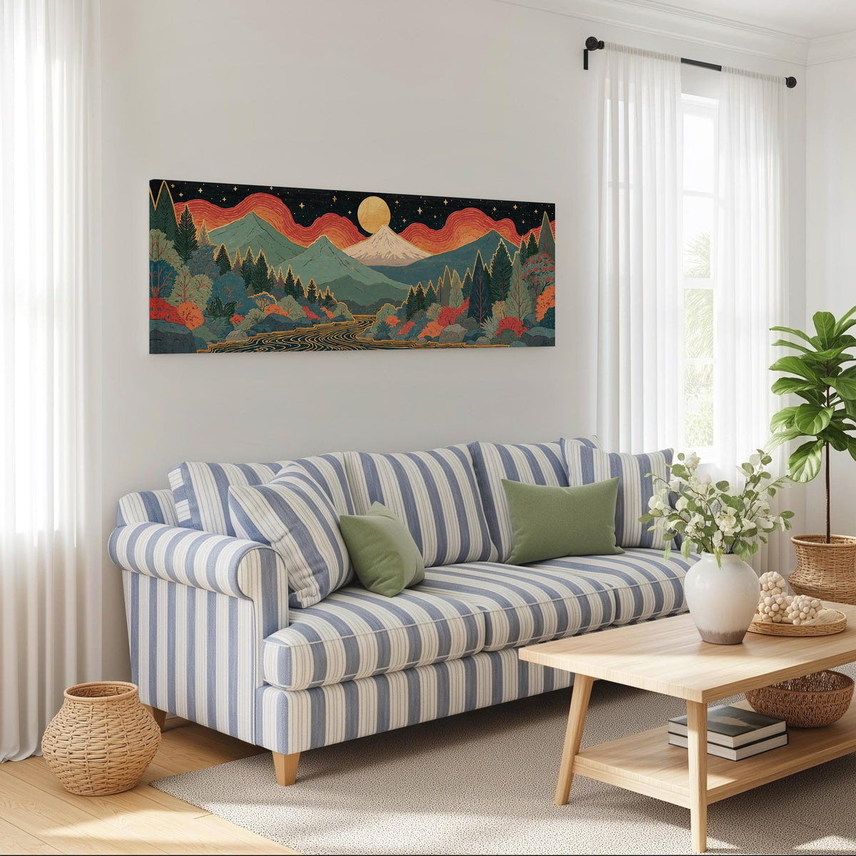 Mystic mountains under a moonrise long horizontal canvas print above a striped sofa in a coastal living room