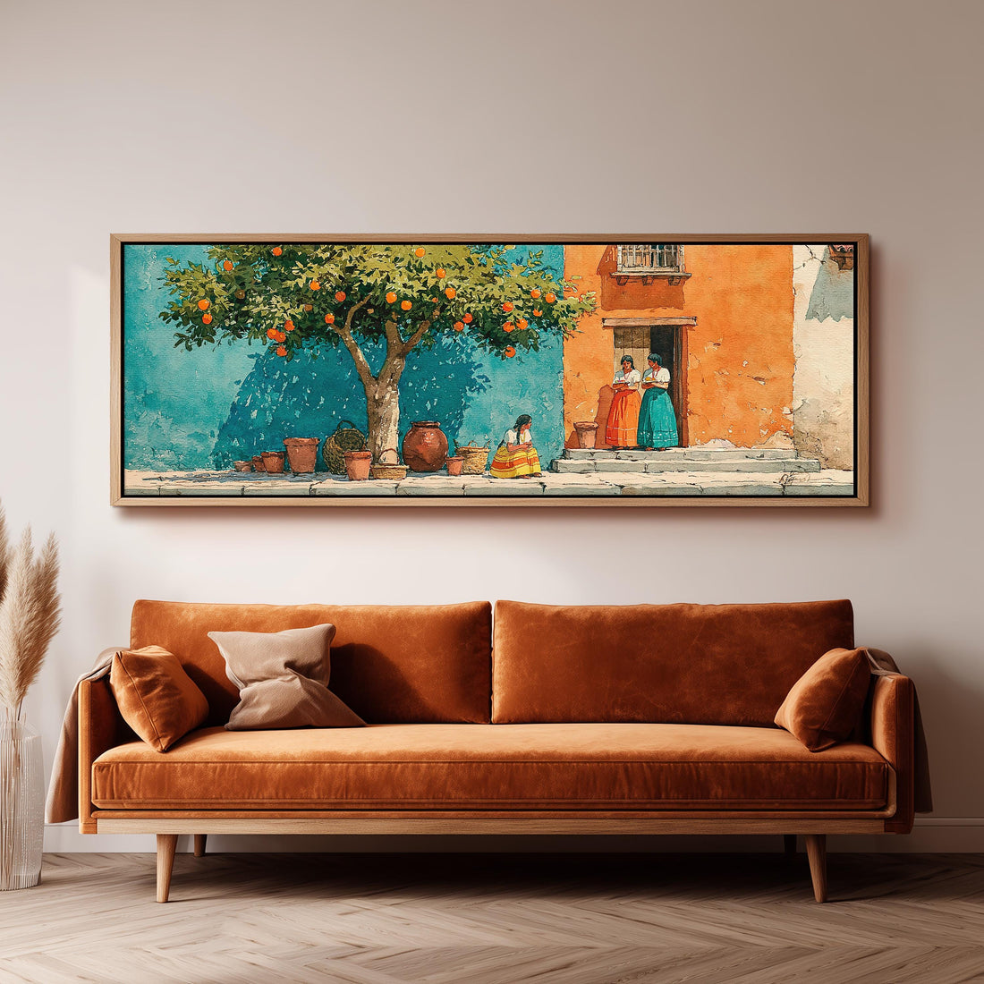 Orange tree on a colorful village street long horizontal canvas print above a sofa in a living room