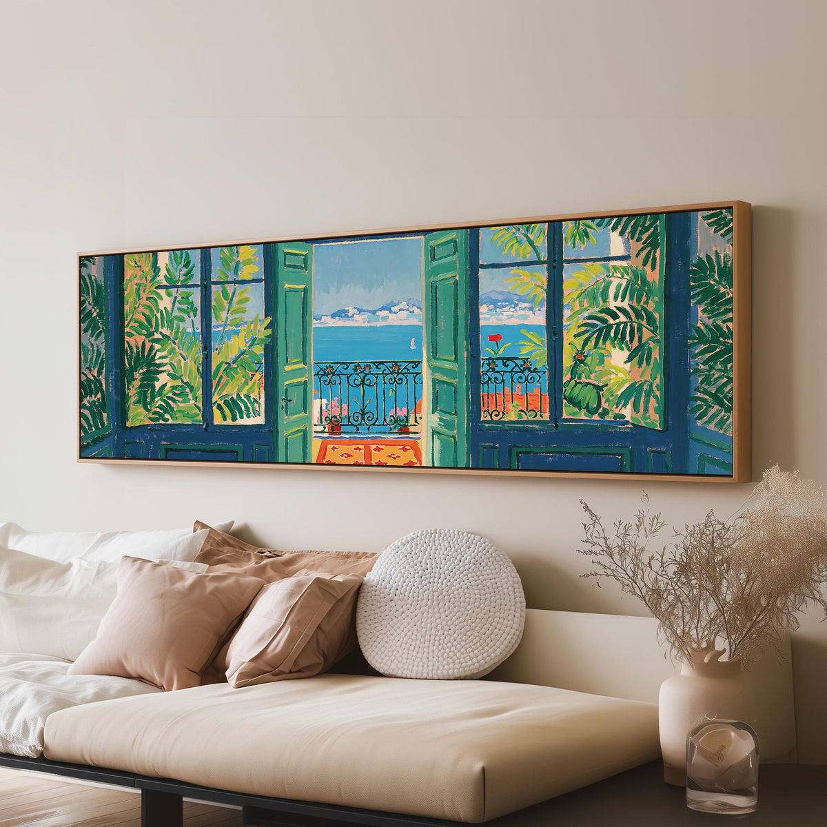 Riviera balcony view through open windows panoramic canvas print above a sofa in a living room