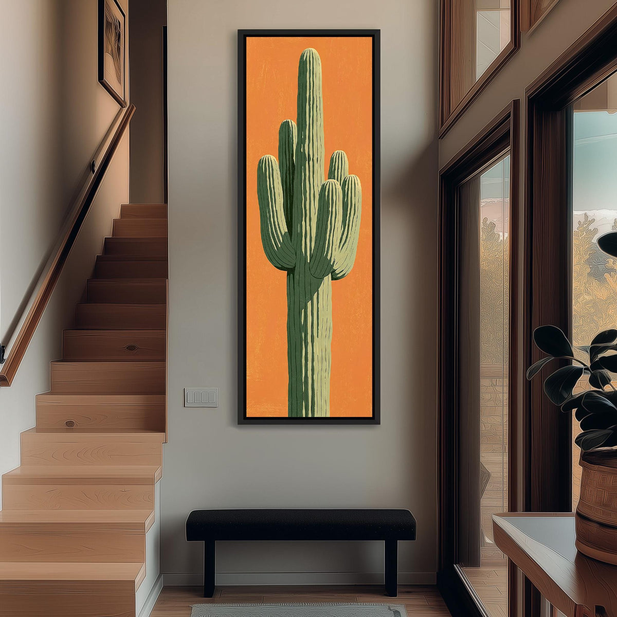 Saguaro cactus on orange tall narrow canvas print beside a staircase in an entryway