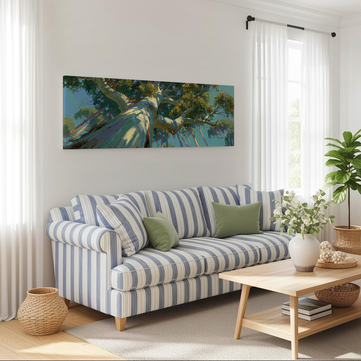 Eucalyptus canopy against a blue sky long horizontal canvas print above a striped sofa in a coastal living room