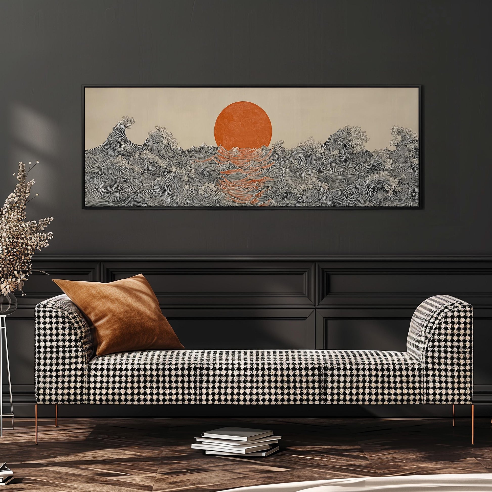 a large, rectangular painting of a sunset over a wave-covered ocean, hanging on a wall above a black and white checkered sofa.