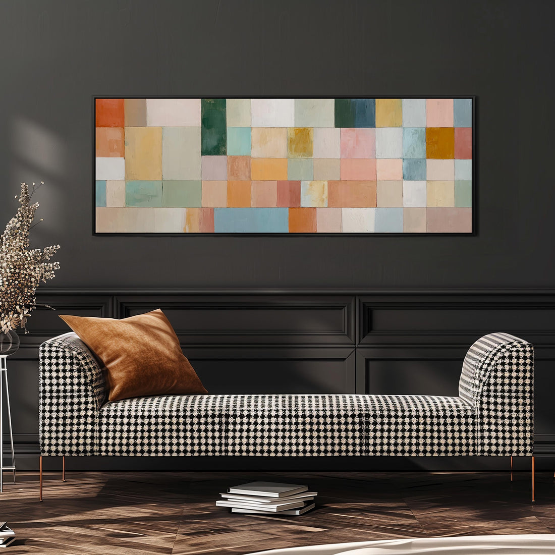 a large, rectangular abstract painting hanging on a wall above a brown sofa with two pillows.