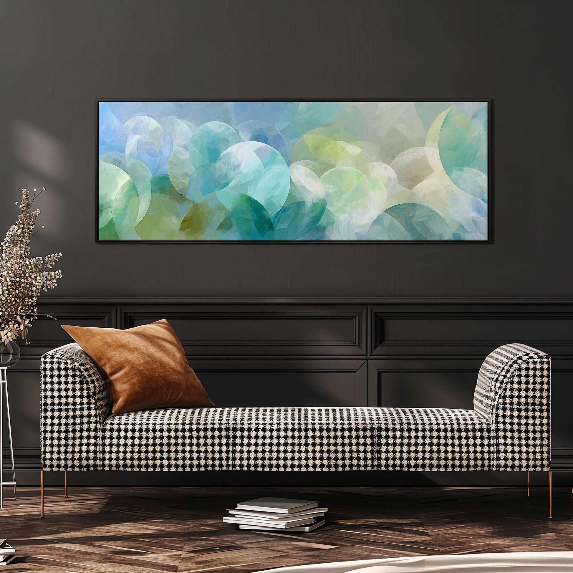 a modern living room with a black and white checkered sofa, a stack of books, and a large abstract painting hanging on the wall above the sofa.