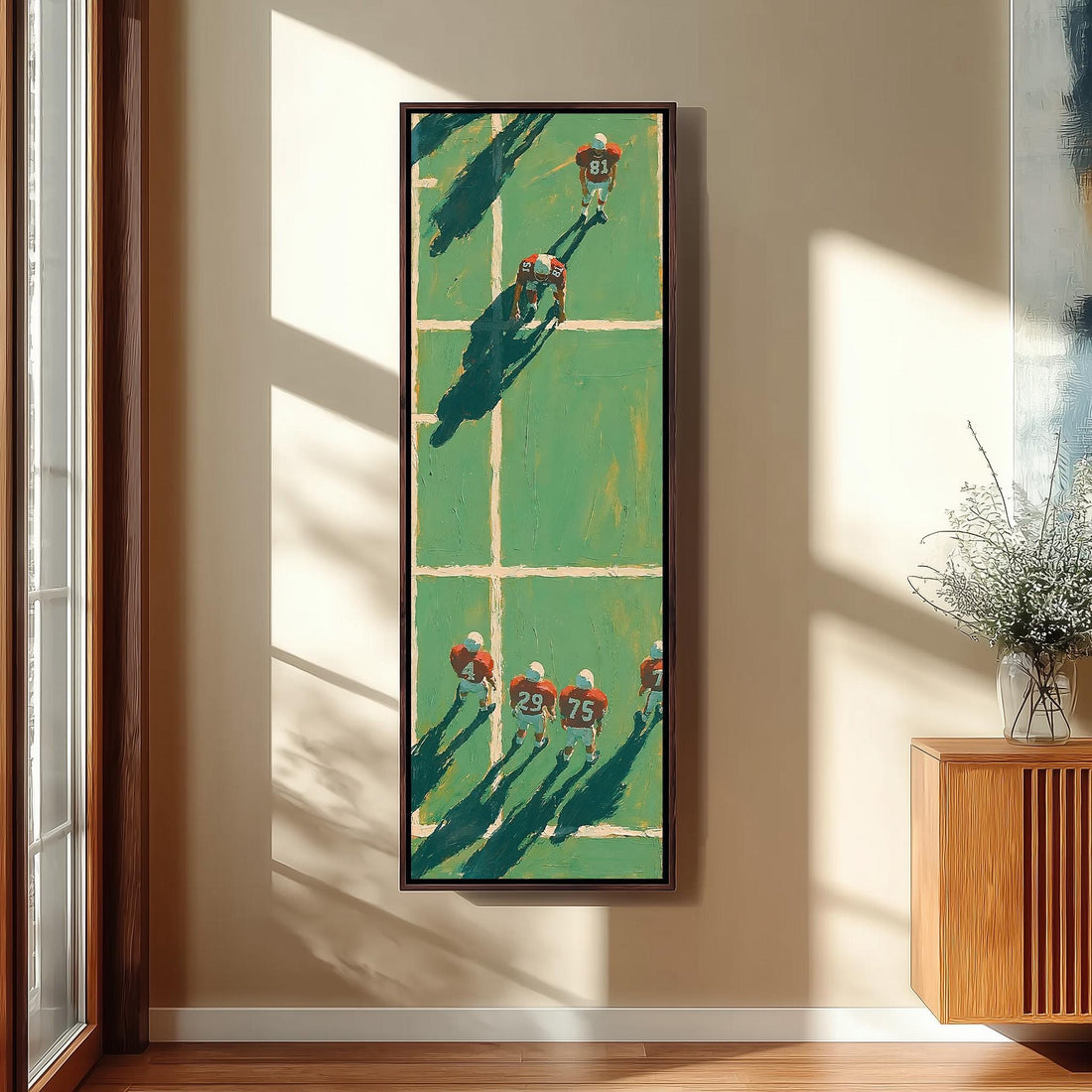 American football players on a field seen from above long vertical canvas print in a sunlit living space