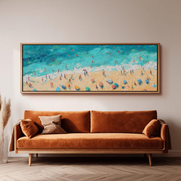 a large painting of a beach scene hanging on a wall above a brown sofa.
