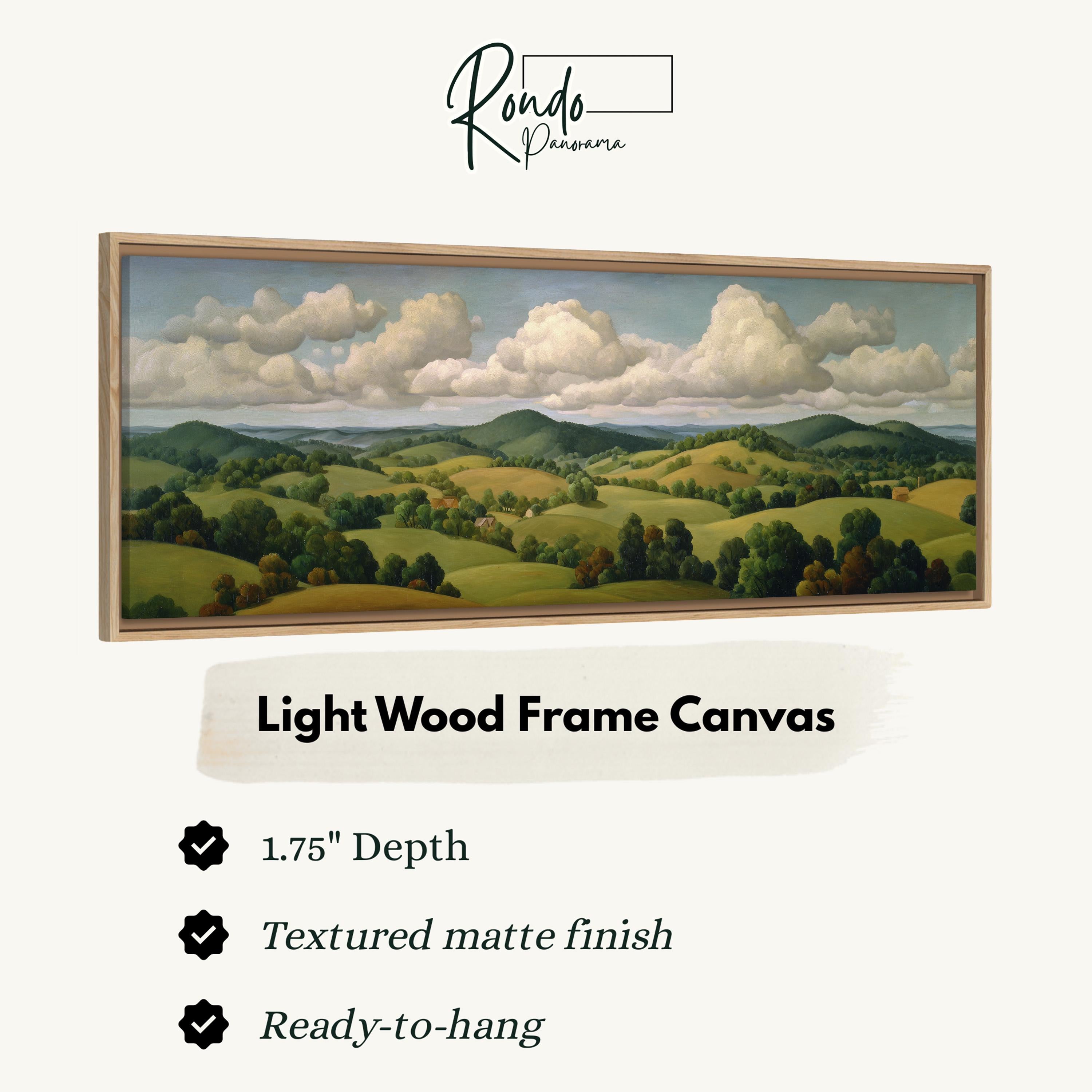 The image is a light wood frame canvas depicting a landscape with rolling hills, trees, and a cloudy sky.