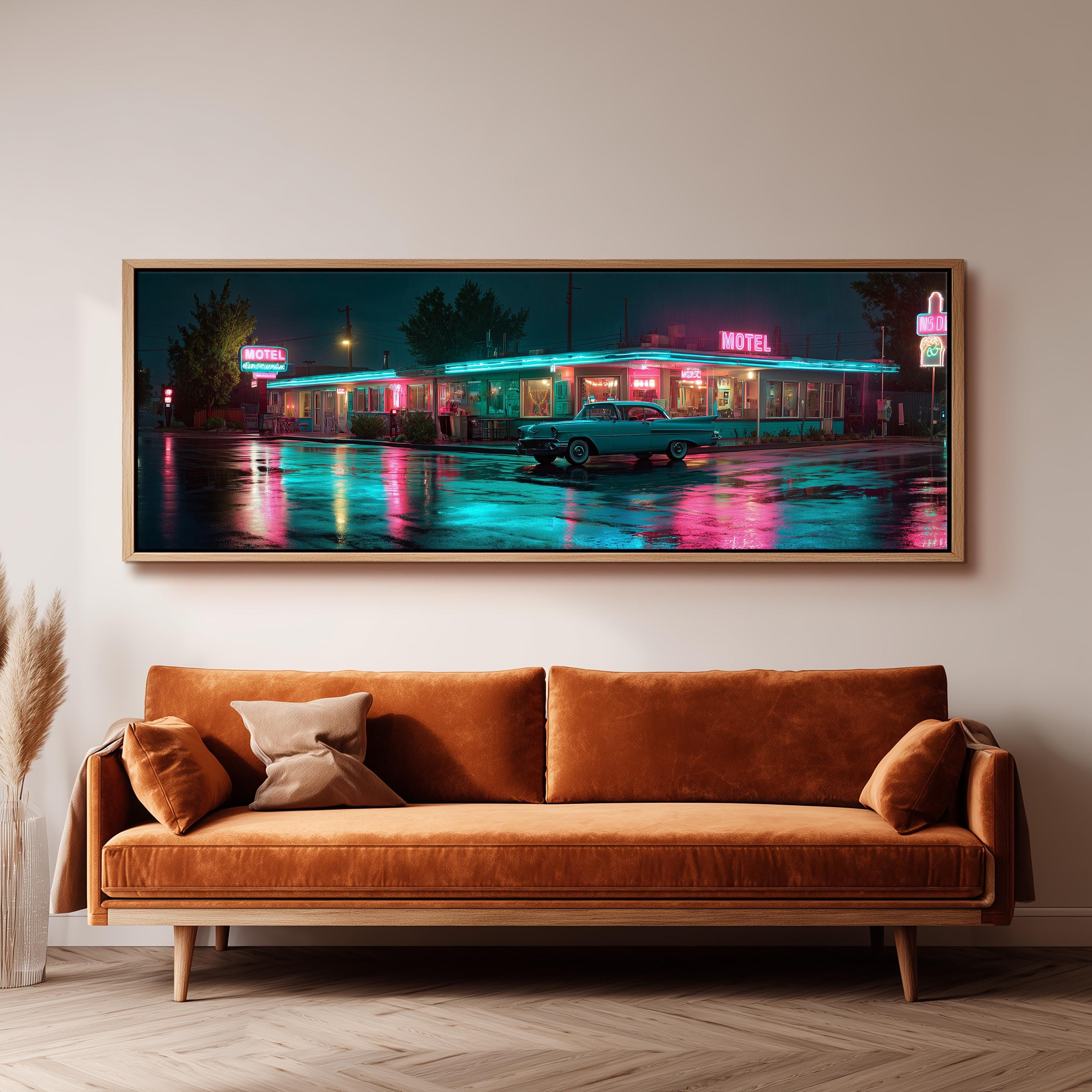 A large framed print depicting a motel at night, with neon signs and a car parked in front of the building.
