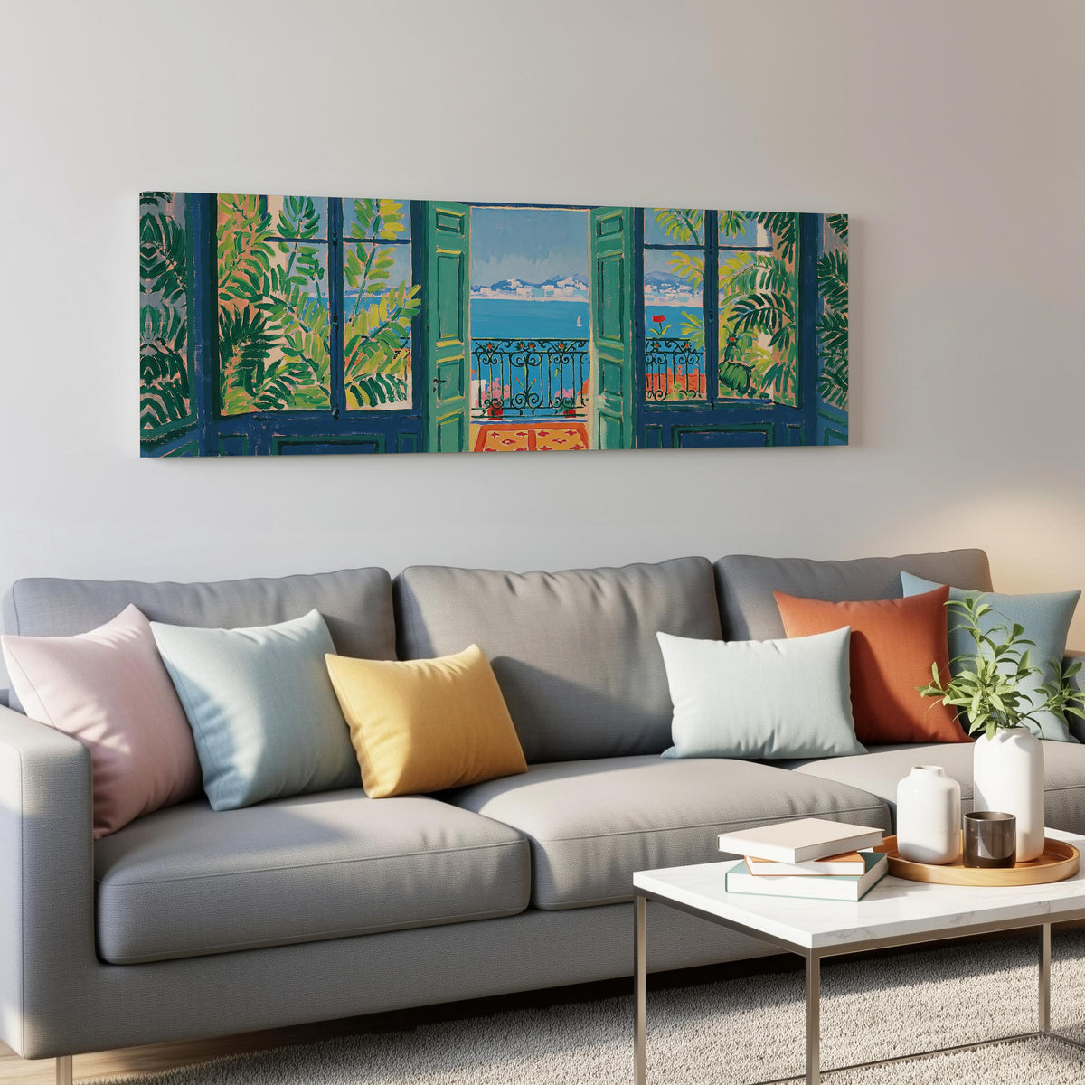 Riviera balcony view through open windows panoramic canvas print above a grey sofa in a living room