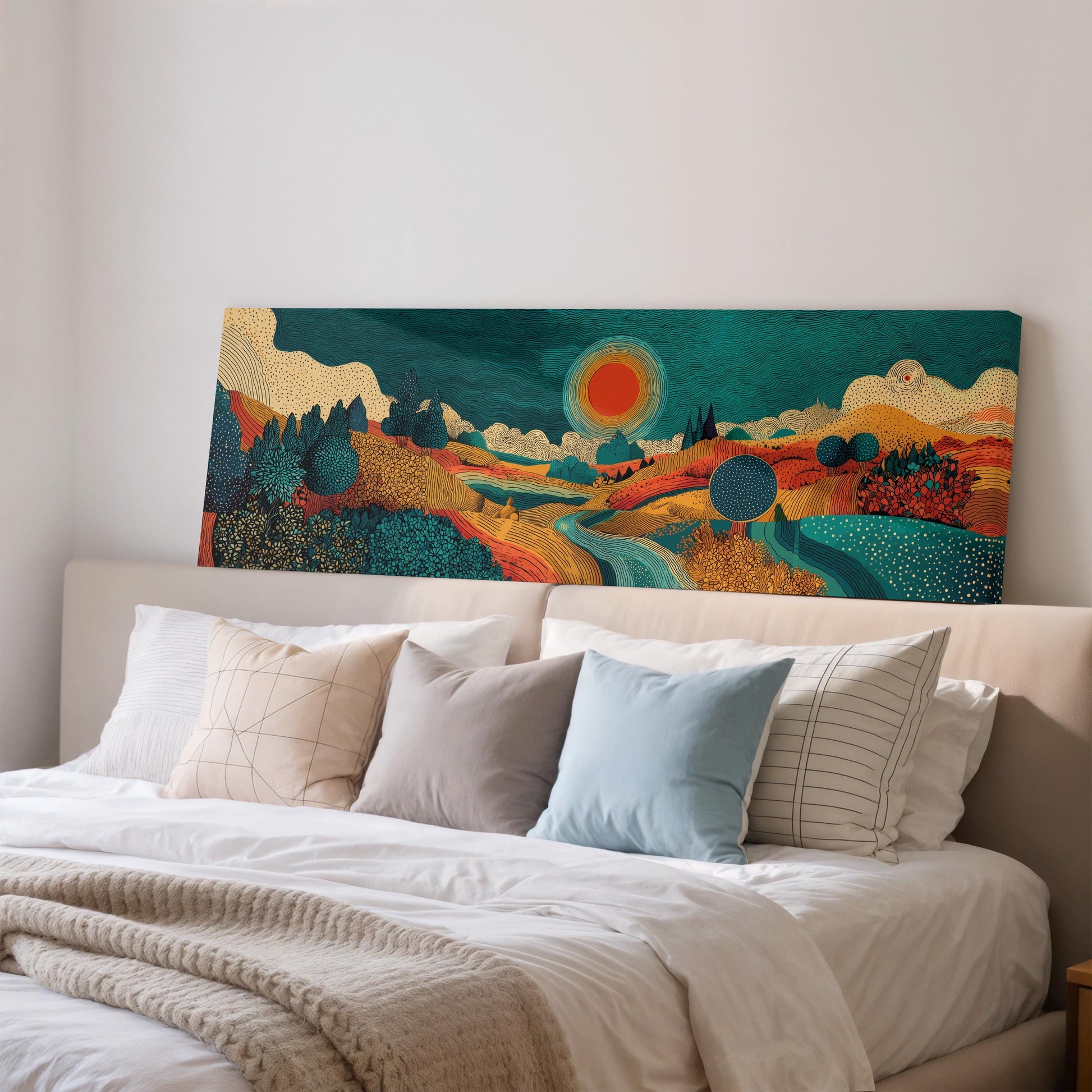 a large, colorful painting of a landscape hanging on a wall above a bed with white pillows and a gray blanket.