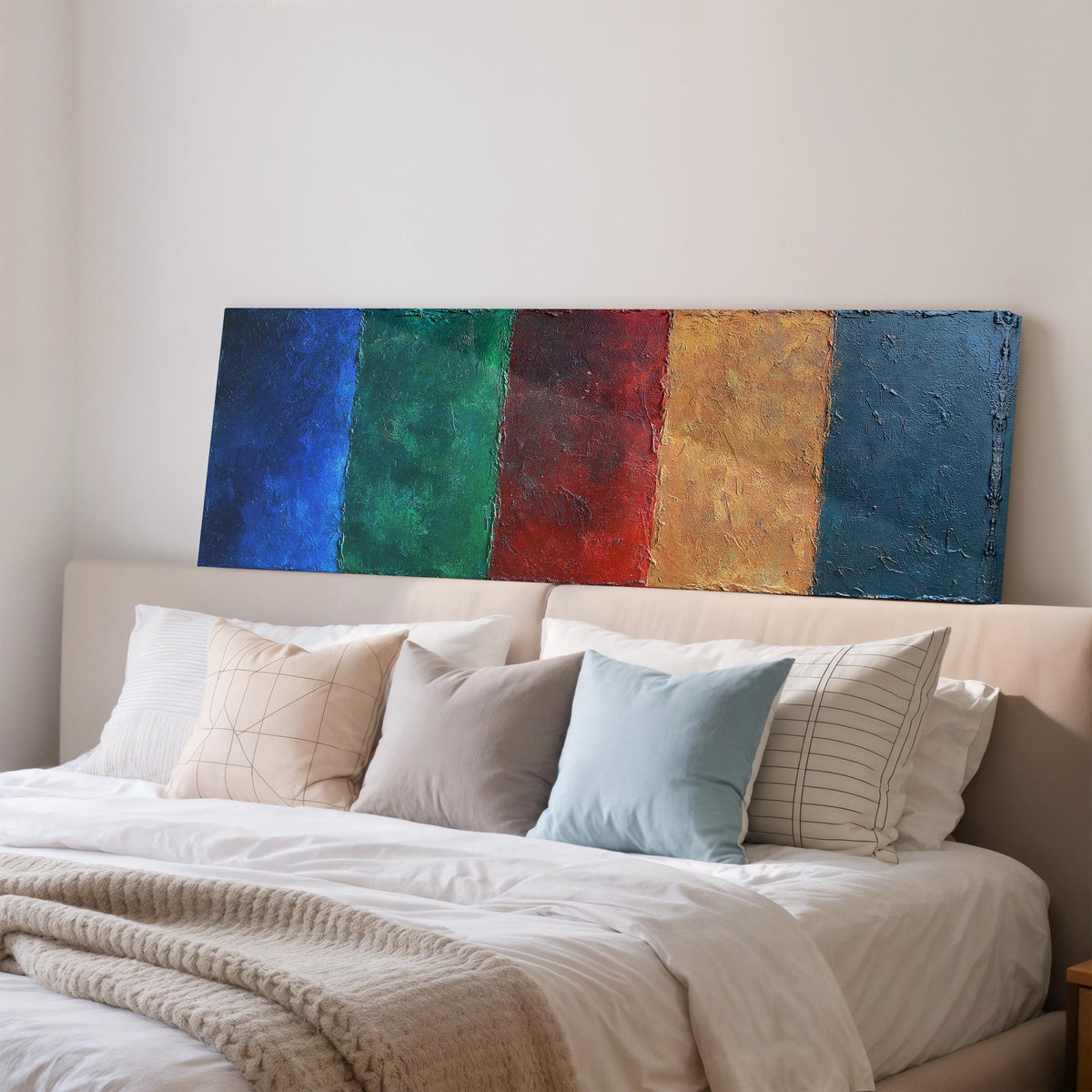 Textured jewel tone vertical bands long horizontal canvas print above a wooden sideboard